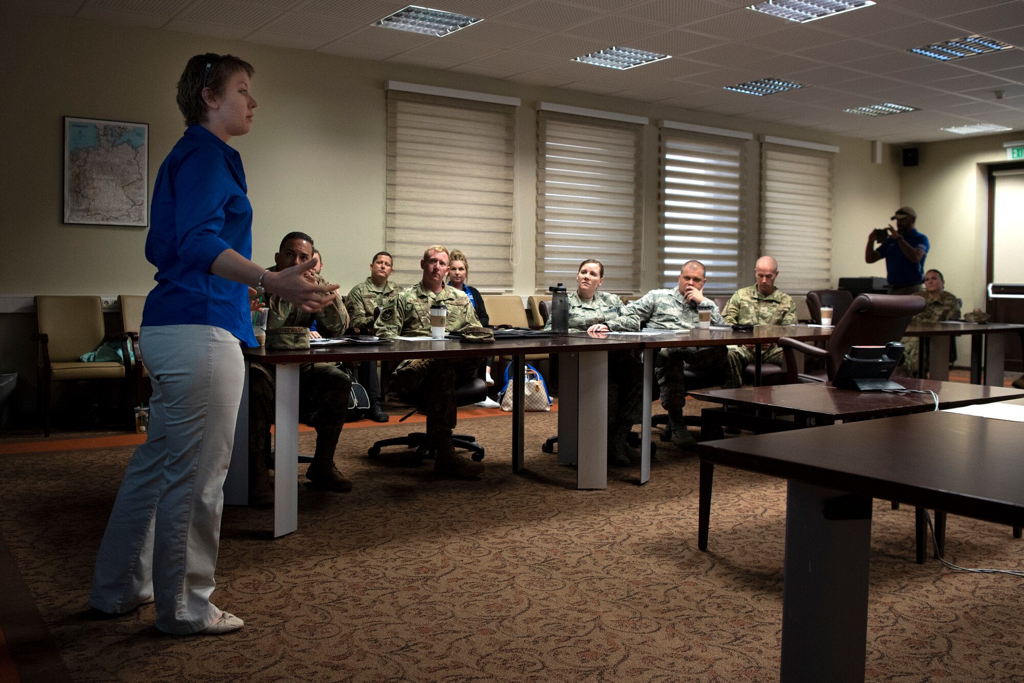 U.S. Air Force Senior Airman Jessica Thelen, Air Force Wounded Warrior Program ambassador, left, speaks at a first sergeant council meeting at Spangdahlem Air Base, Germany, July 23, 2019. Thelen received help from the program during her battle with cancer. The Wounded Warrior Program's goal is to leave Airmen well-equipped to manage challenges, regardless of injury or illness. The program helps those with both physical wounds and invisible wounds, such as post-traumatic stress disorder, from either combat or non-combat scenarios. (U.S. Air Force photo by Airman 1st Class Valerie Seelye)