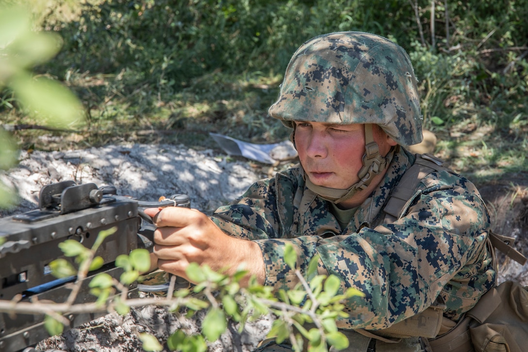 A U.S. Marine with Headquarters Battery, 2nd Battalion, 14th Marine Regiment, 4th Marine Division, sights in while positioned in his entry control point to provide security during their annual training event Operation Zeus, Fort Hood, Texas, July 18, 2019. Annual training exercises ensure Reserve Marines are proficient and capable of successful integration with their active duty counterparts. (U.S. Marine Corps photo by Cpl. Serine Farahi)
