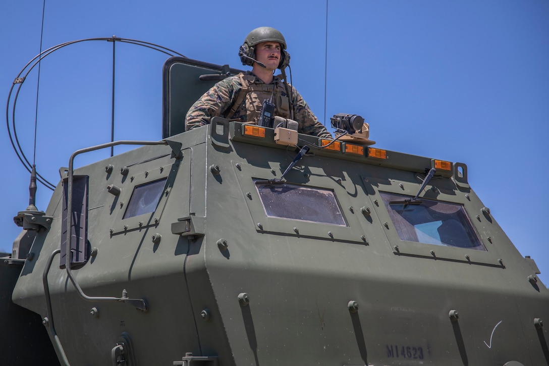 U.S. Marine Cpl. Christian Davis, a High Mobility Rocket System operator with Fox Battery, 2nd Battalion, 14th Marine Regiment, 4th Marine Division, positions as a gunner on a HIMARS during their annual training event Operation Zeus, Fort Hood, Texas, July 18, 2019. Annual training exercises ensure Reserve Marines are proficient and capable of successful integration with their active duty counterparts. (U.S. Marine Corps photo by Cpl. Serine Farahi)