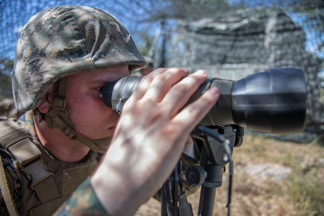 A U.S. Marine with Fox Battery, 2nd Battalion, 14th Marine Regiment, 4th Marine Division, positions as a forward observer for a High Mobility Artillery Rocket System during their annual training event Operation Zeus, Fort Hood, Texas, July 18, 2019. Annual training exercises ensure Reserve Marines are proficient and capable of successful integration with their active duty counterparts. (U.S. Marine Corps photo by Cpl. Serine Farahi)