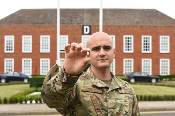 U.S. Air Force Tech. Sgt. Ian Velez, 100th Communications Squadron NCO-in-charge of radio frequency transmissions, displays a second lieutenant’s bar at RAF Mildenhall, England, July 17, 2019. Velez earned his commission as an officer and will depart later this month to attend Officer Training School at Maxwell Air Force Base, Alabama. (U.S. Air Force photo by Airman 1st Class Joseph Barron)