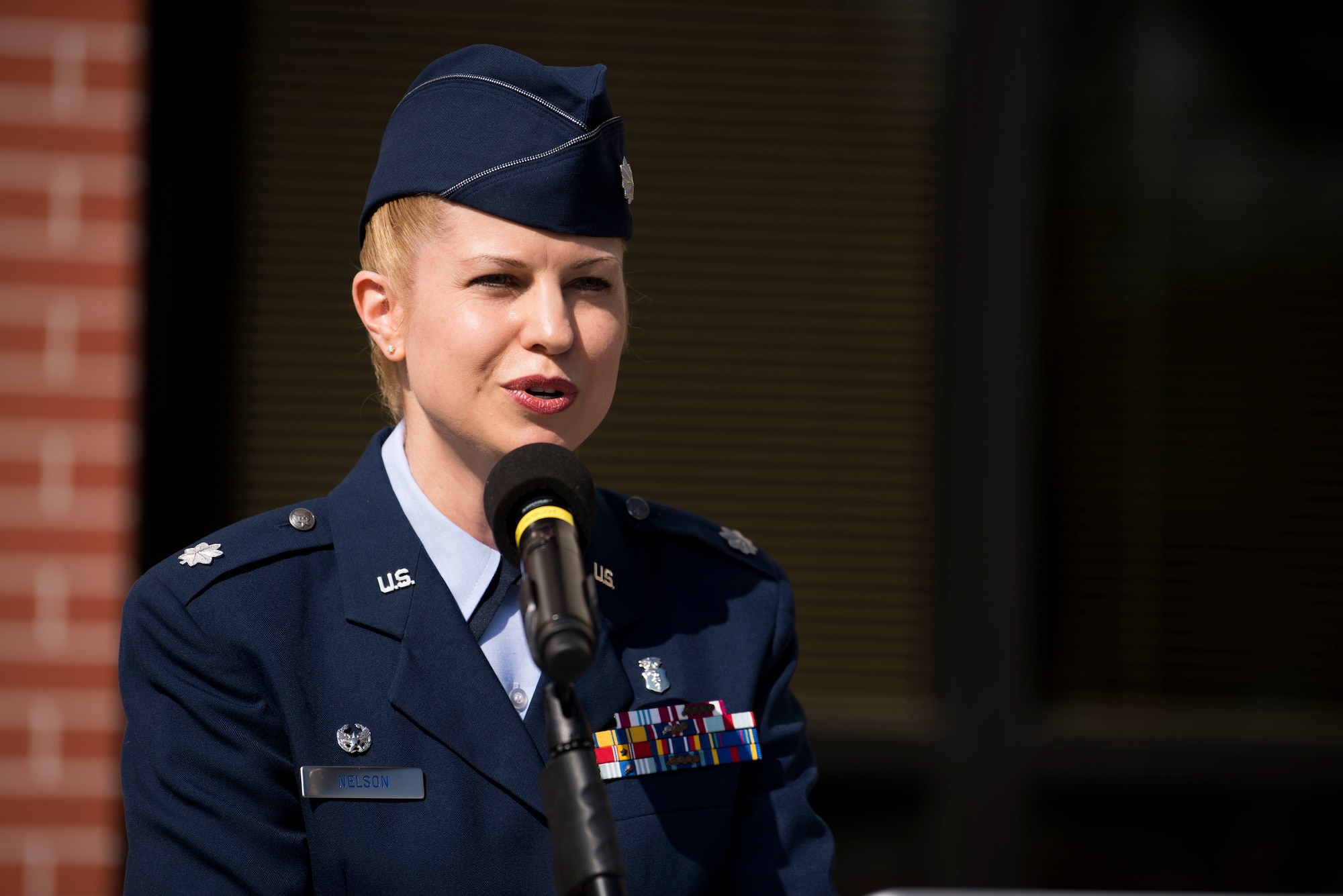 U.S. Air Force Lt. Col. Heather Nelson, 92nd Medical Group commander, gives remarks during the 92nd MDG re-designation ceremony at Fairchild Air Force Base, Washington, July 19, 2019. The re-designation is a two-phase program with the purpose to increase mission readiness and ensure high quality health care by designating two squadrons to care for service members and beneficiaries separately. (U.S. Air Force photo by Airman 1st Class Lawrence Sena)