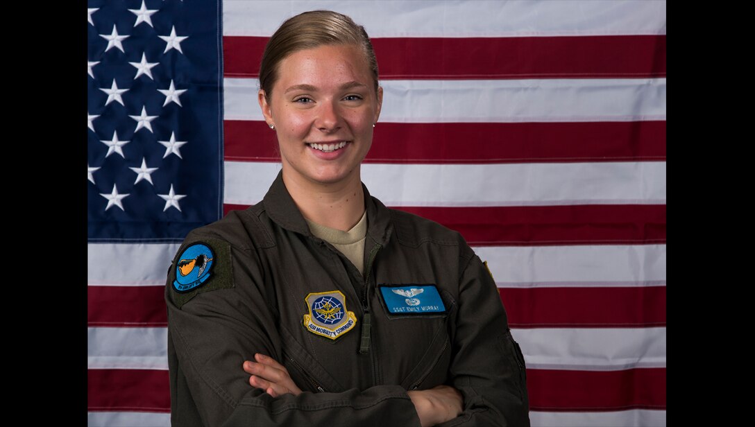 Staff Sgt. Emily Murray, 9th Airlift Squadron flight engineer, stands by the U.S. flag July 11, 2019, at Dover Air Force Base, Del. Murray traveled to Joint Base Langley to have her measurements taken, along with 60 other female aviators from the U.S. Air Force and the U.S. Navy. The measurements were taken because flight equipment is in the process of being redesigned to better fit female aviators. (U.S. Air Force photo by Senior Airman Christopher Quail)