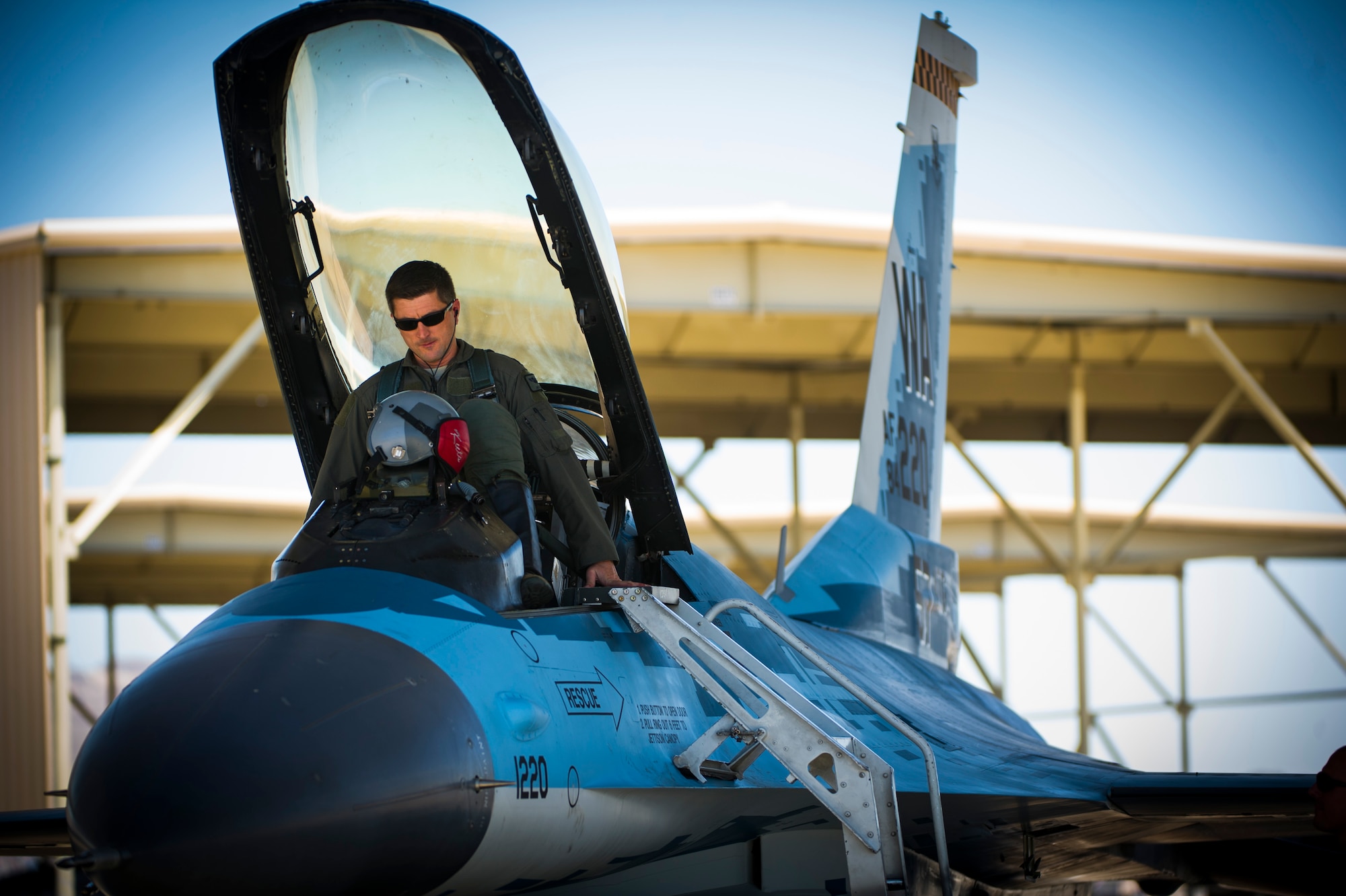 Lt. Col. Jan Stahl, 706th Fighter Squadron commander, positions himself inside an F-16 fighting falcon July 16, 2019, at Nellis Air Force Base, Nev. Red Flag focuses on the application of core missions to include Command and Control, Intelligence Surveillance, Strike and Personnel Recovery and how to work with Coalition counterparts to ensure success. The 706th Fighter Squadron oversees Air Force Reserve Command members assigned to the U.S. Air Force Warfare Center, supporting missions in its 57th Wing, 53rd Wing and 505th Command and Control Wing. Pilots assigned to the 706 FS fly an array of aircraft to include the F-15C, F-15E, F-16, F-22 and F-35 aircraft. To prepare combat air forces, joint and allied crews with realistic training, pilots in the 706 FS operate with the 64th Aggressor Squadron to facilitate operational threat replication, training, and feedback. The Red Flag exercise will continue through July 26, 2019.