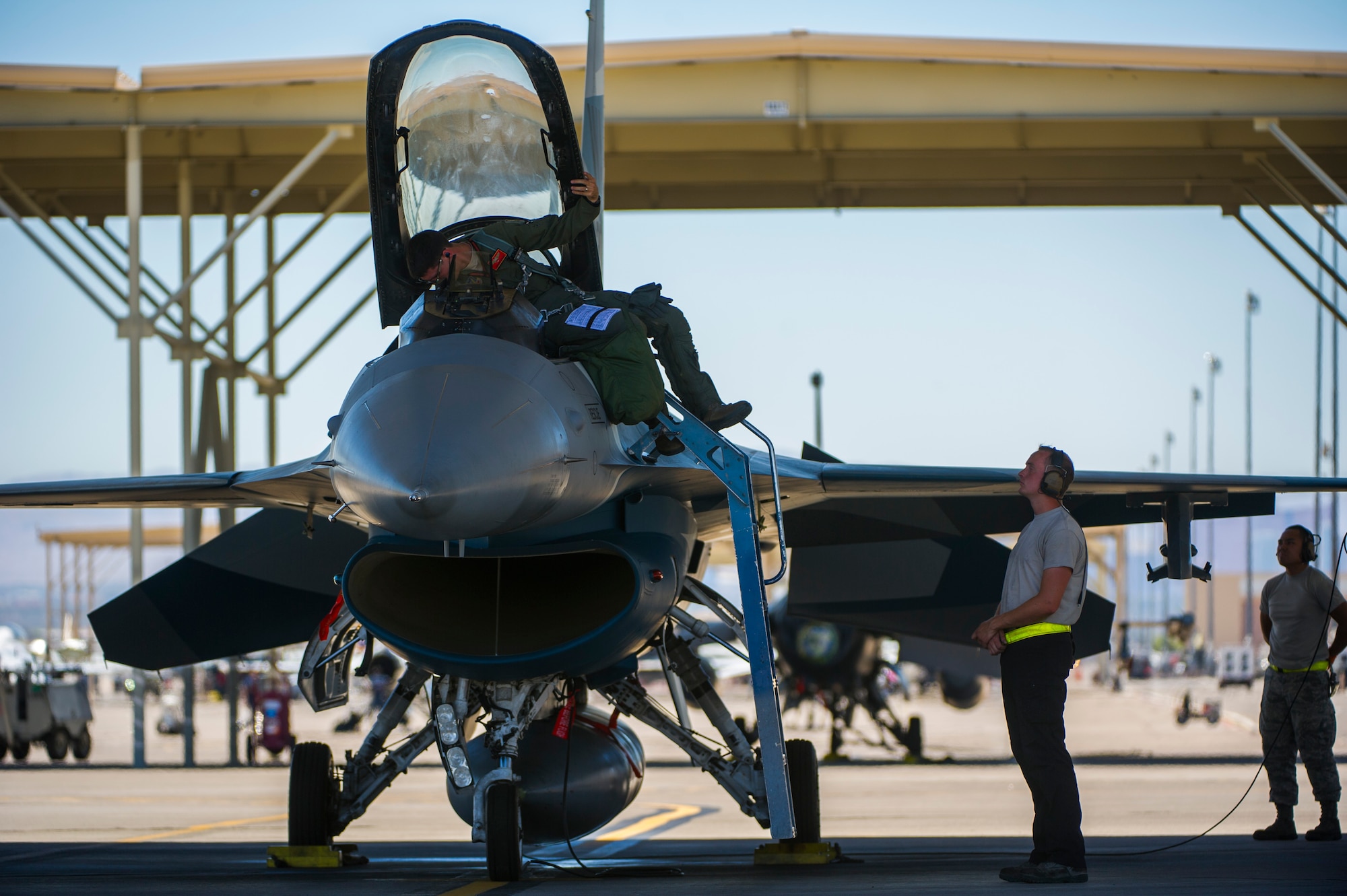 A 706th Fighter Squadron F-16 pilot prepares his equipment inside the cockpit of the aircraft July 16, 2019, at Nellis Air Force Base, Nev. Red Flag focuses on the application of core missions to include Command and Control, Intelligence Surveillance, Strike and Personnel Recovery and how to work with Coalition counterparts to ensure success. The 706th Fighter Squadron oversees Air Force Reserve Command members assigned to the U.S. Air Force Warfare Center, supporting missions in its 57th Wing, 53rd Wing and 505th Command and Control Wing. Pilots assigned to the 706 FS fly an array of aircraft to include the F-15C, F-15E, F-16, F-22 and F-35 aircraft. To prepare combat air forces, joint and allied crews with realistic training, pilots in the 706 FS operate with the 64th Aggressor Squadron to facilitate operational threat replication, training, and feedback. The Red Flag exercise will continue through July 26, 2019.