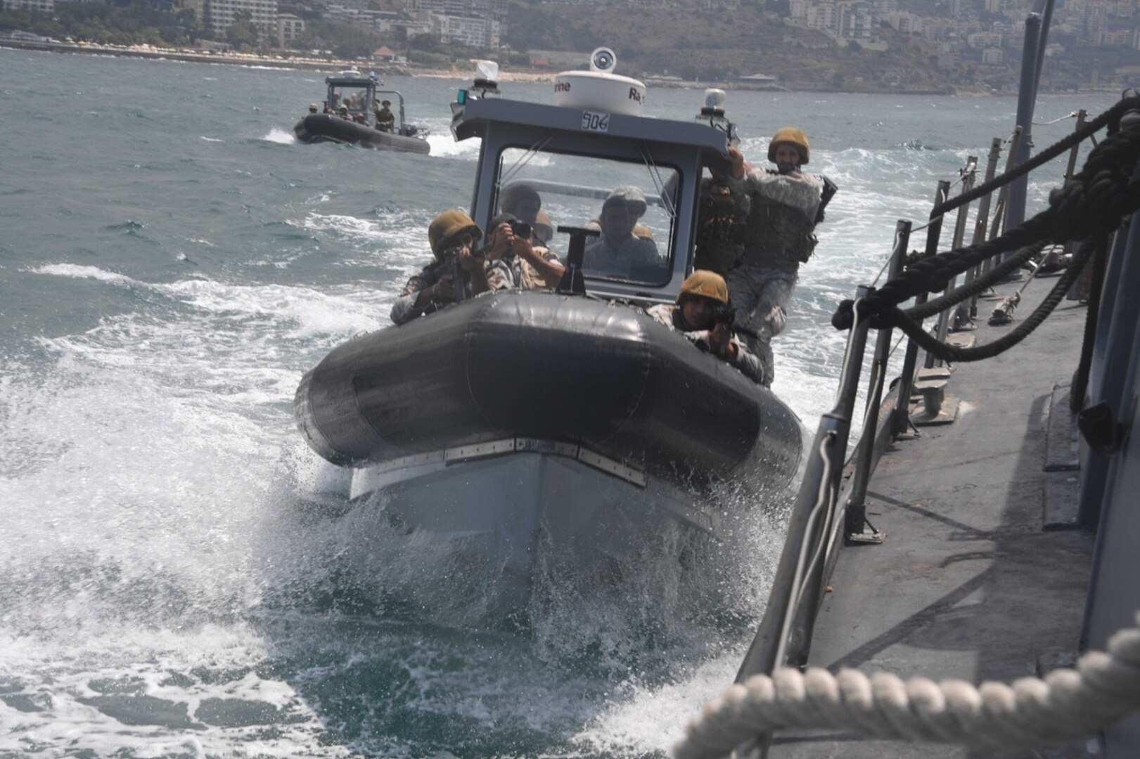 Members of the Lebanese Armed Forces (LAF) Marine Commando Regiment pull alongside a ship as part of a visit, board, search and seizure drill during exercise Resolute Response (RR) 19. RR19 is an annual bilateral explosive ordnance disposal and maritime security exercise between U.S. 5th Fleet and LAF to enhance mutual capabilities and interoperability. (U.S. Navy photo by Mass Communication Specialist 3rd Class Dawson Roth/Released)
