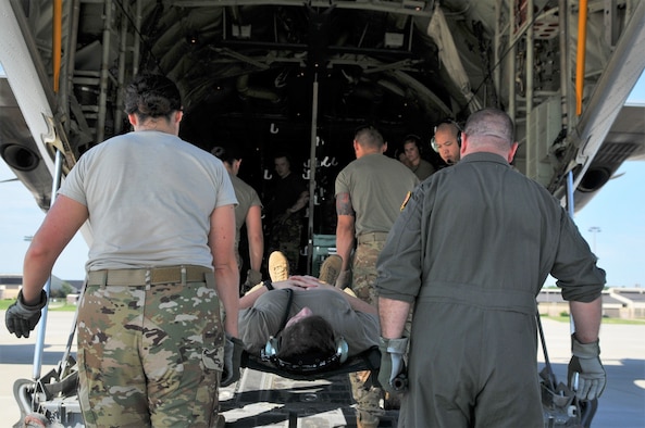 Pope’s 43d Aeromedical Evacuation Squadron (AES) gets set to load the aircraft during a tandem Aeromedical Readiness Mission