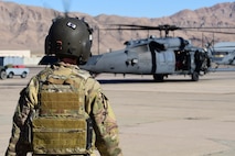 Capt. Nicole Sargent, 66th Rescue Squadron HH-60G Pave Hawk pilot, walks toward a helicopter to prepare for takeoff from Nellis Air Force Base, Nevada, July 15, 2019. The 66th RS slogan is “Haec ago ut alii vivant,” which is Latin for “These things we do, that others may live.” (U.S. Air Force photo by Senior Airman Haley Stevens)