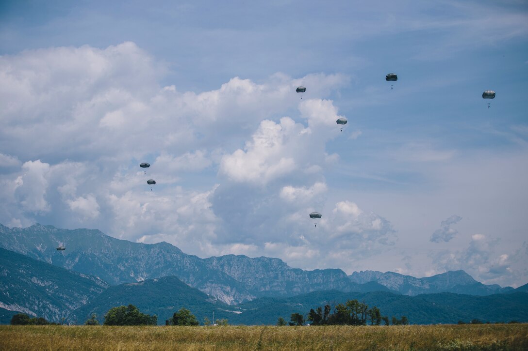 Paratroopers descending to the ground.