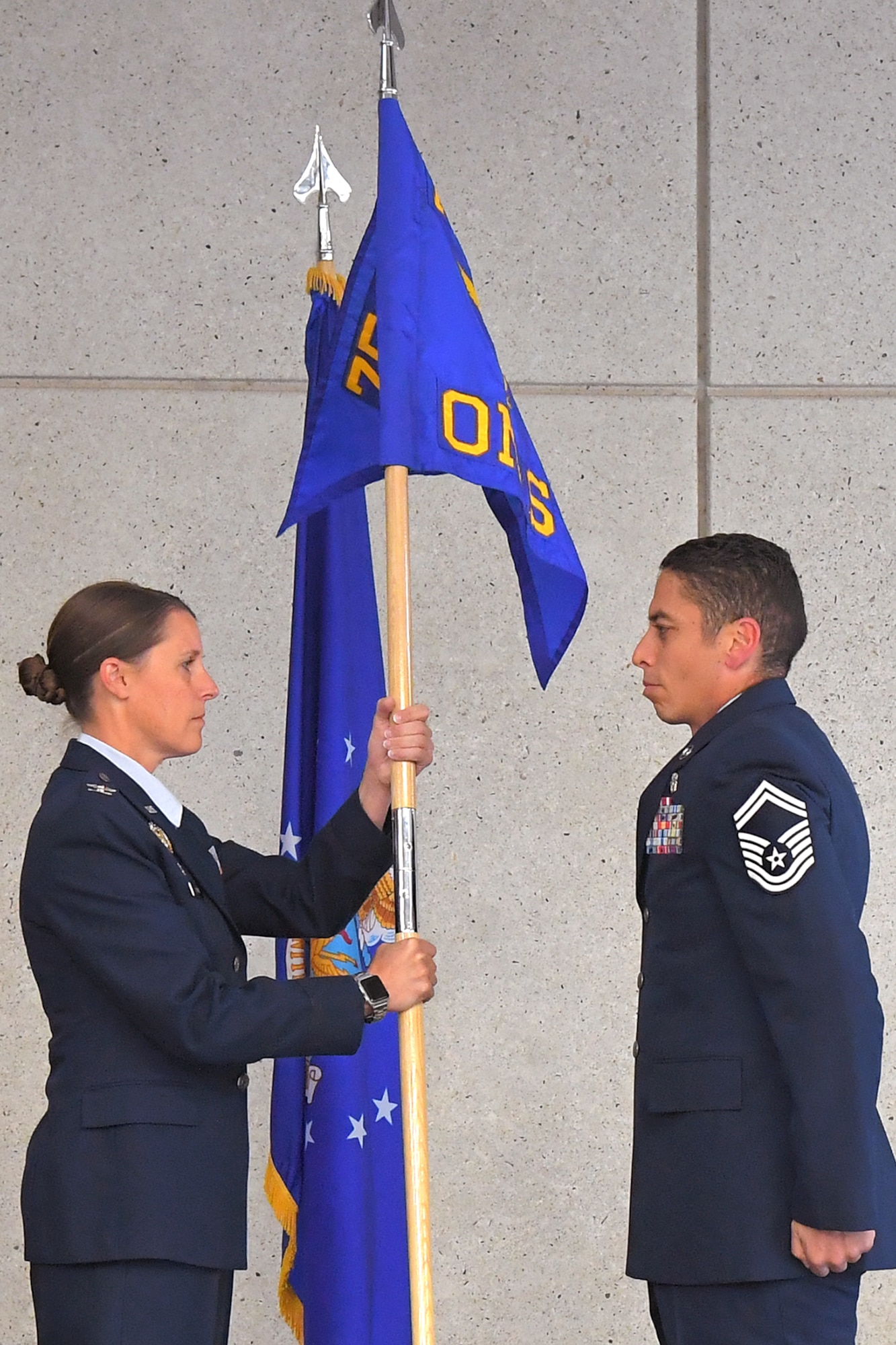 Col. Michelle Brown, 75th Operational Medical Readiness Squadron commander, receives the unit’s new guidon from Senior Master Sgt. Luis Magana, 75th OMRS superintendent, during a squadron inactivation and redesgination ceremony July 12, 2019, at Hill Air Force Base, Utah. During the ceremony, the 75th Aerospace Medicine Squadron was inactivated and then redesignated as the 75th Operational Medical Readiness Squadron. The change is part of an Air Force initiative to improve patient care and military readiness. (U.S. Air Force photo by U.S. Air Force photo by Todd Cromar)