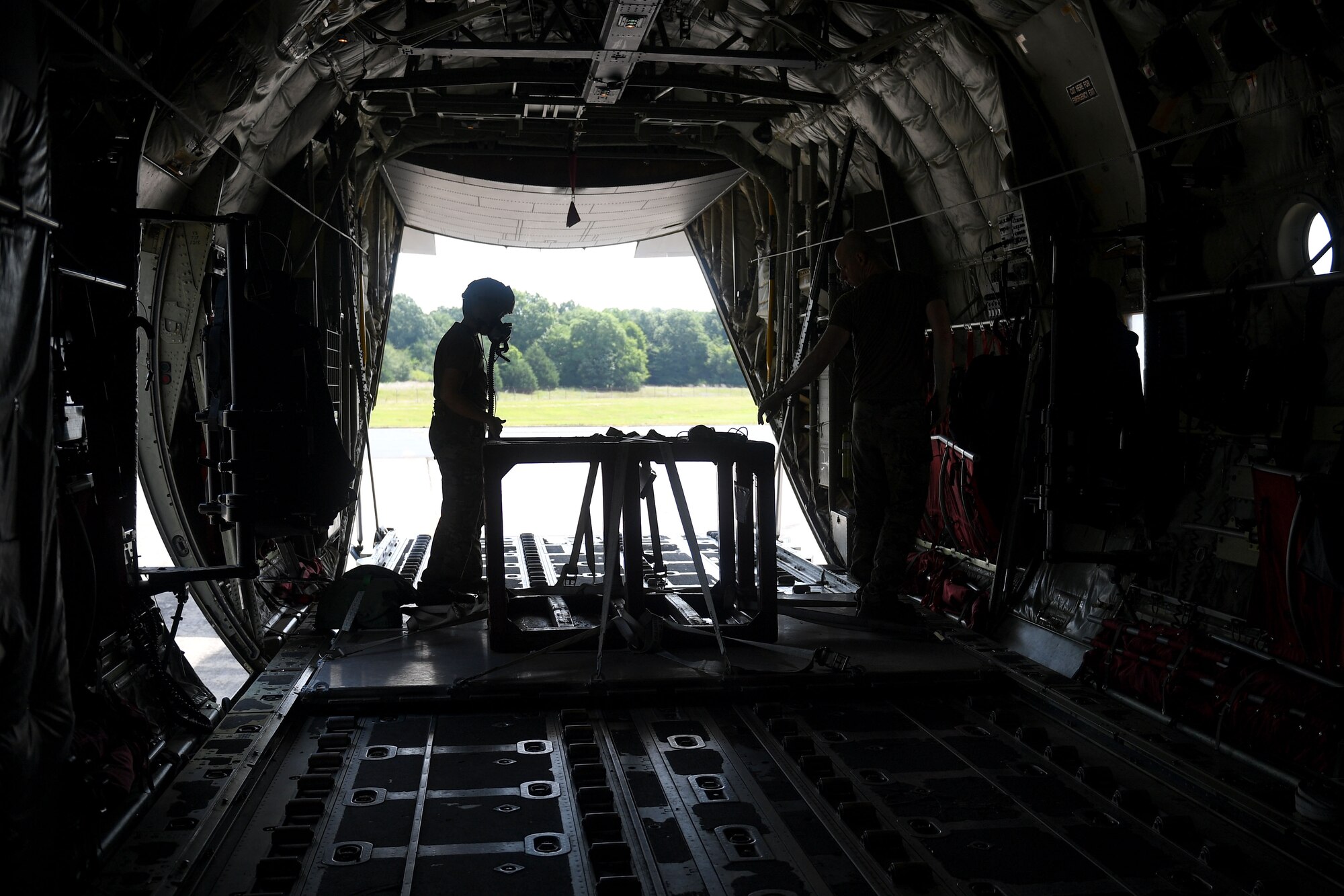 A loadmaster wears a flight mask.