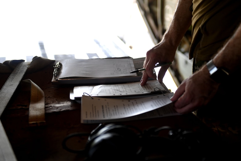 A man opens a book.