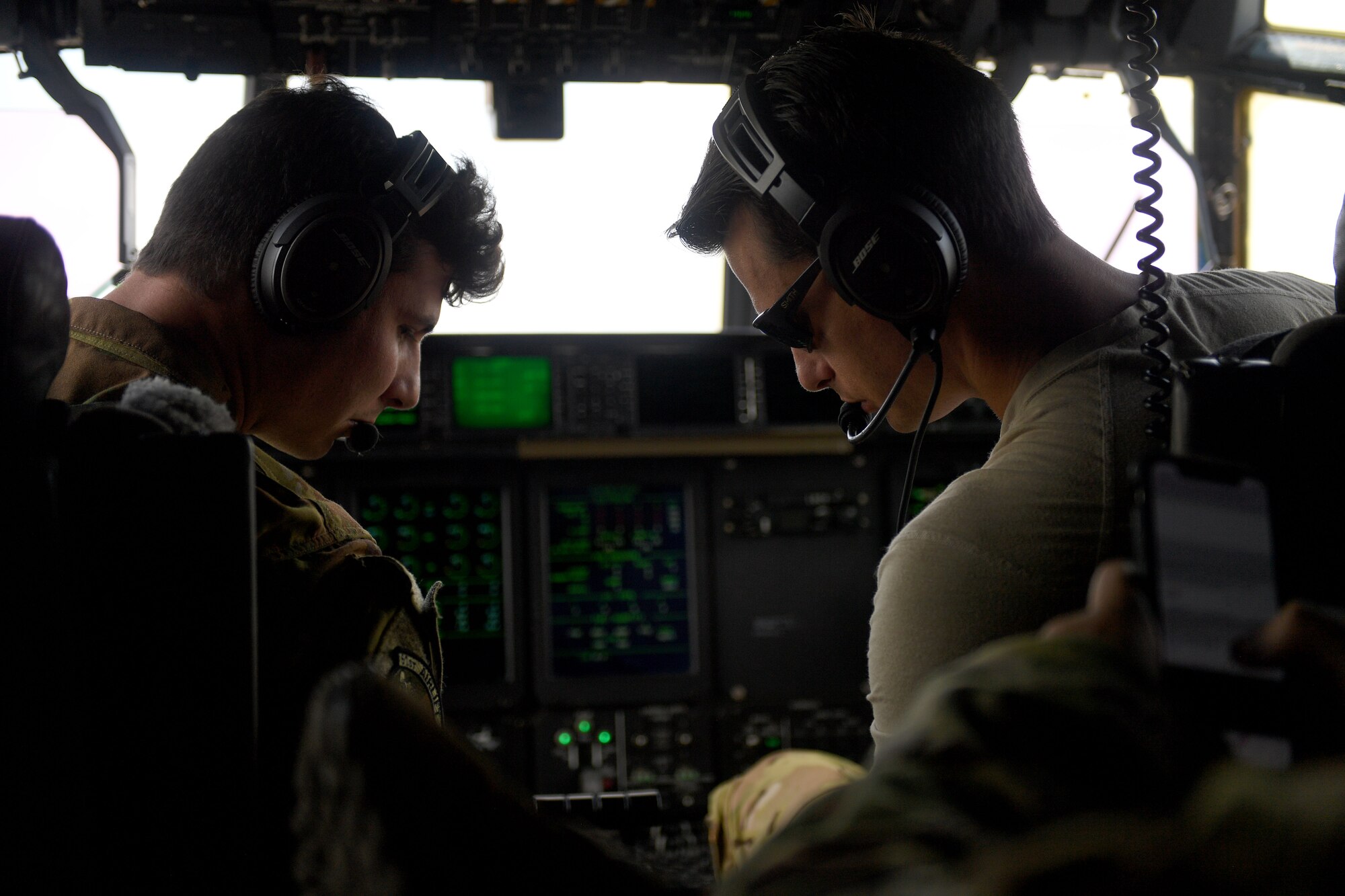 Two pilots prepare to fly C-130J