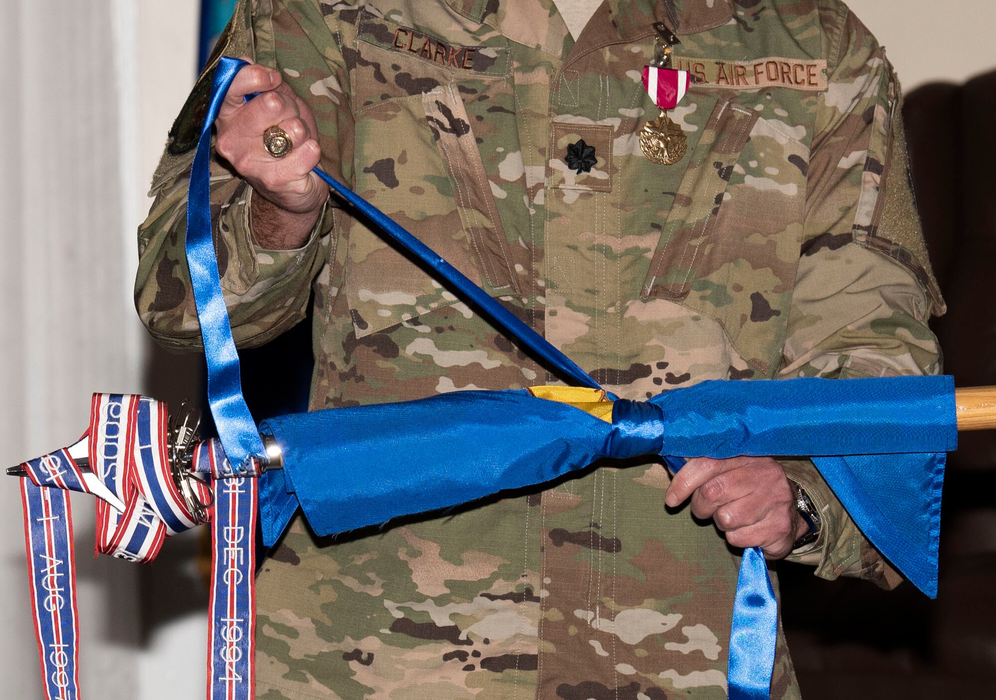 U.S. Air Force Lt. Col. Benjamin Clarke, former 20th Dental Squadron (DS) commander, rolls up the 20th DS guidon as part of the squadron’s deactivation at Shaw Air Force Base, South Carolina, July 18, 2019.