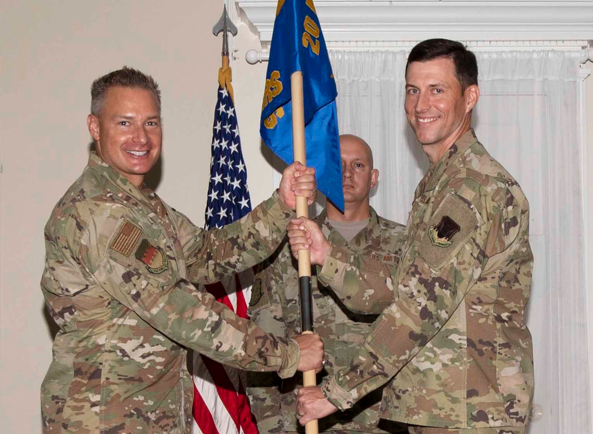 U.S. Air Force Lt. Col. Benjamin Gantt, 20th Operational Medical Readiness Squadron (OMRS) commander, right, assumes command of the 20th OMRS from Col. Christian Lyons, 20th Medical Group commander, at Shaw Air Force Base, South Carolina, July 18, 2019.