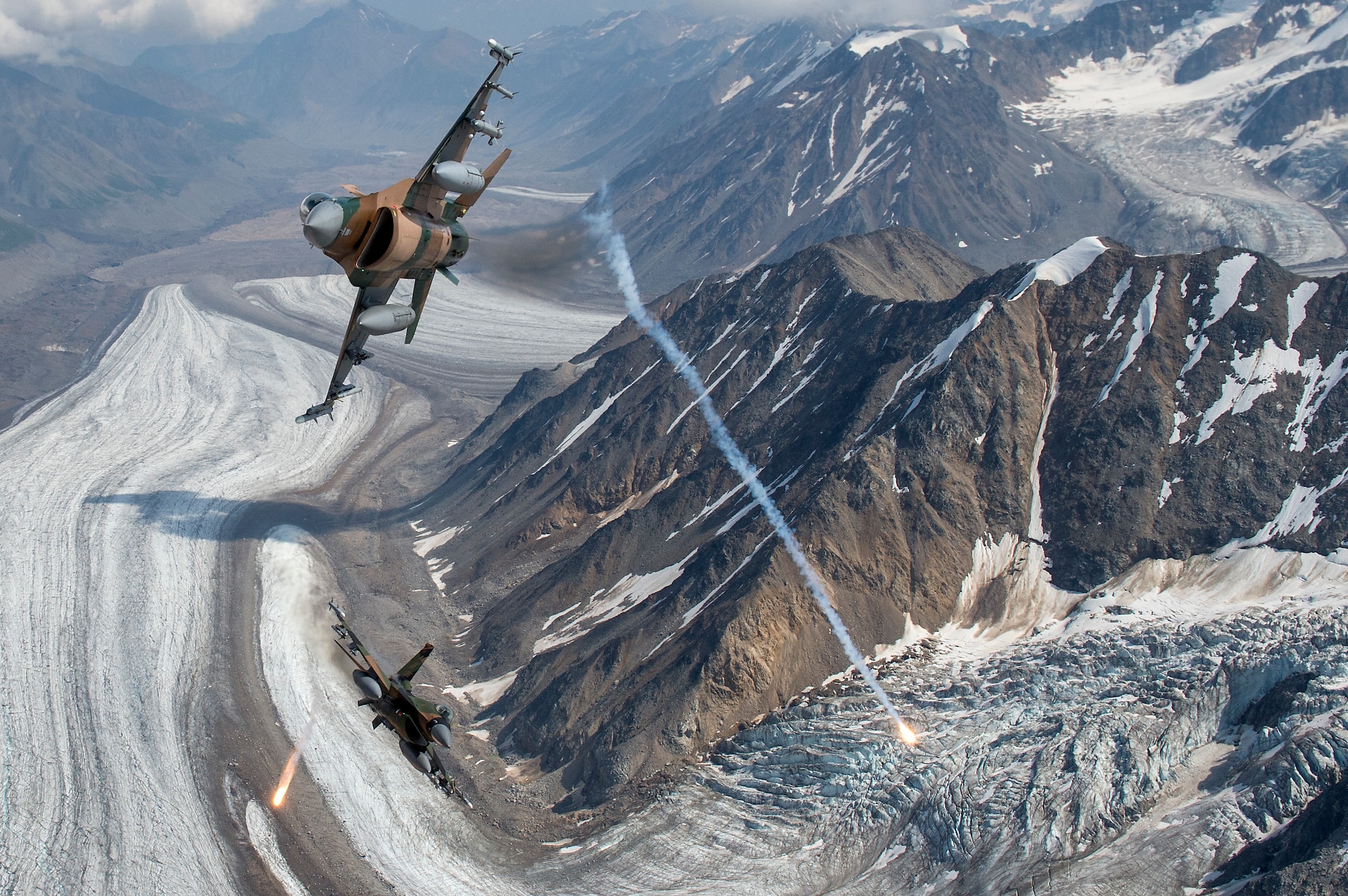 U.S. Air Force F-16 Fighting Falcons from Eielson Air Force Base, fly in formation over the Joint Pacific Alaska Range Complex, July 18, 2019.