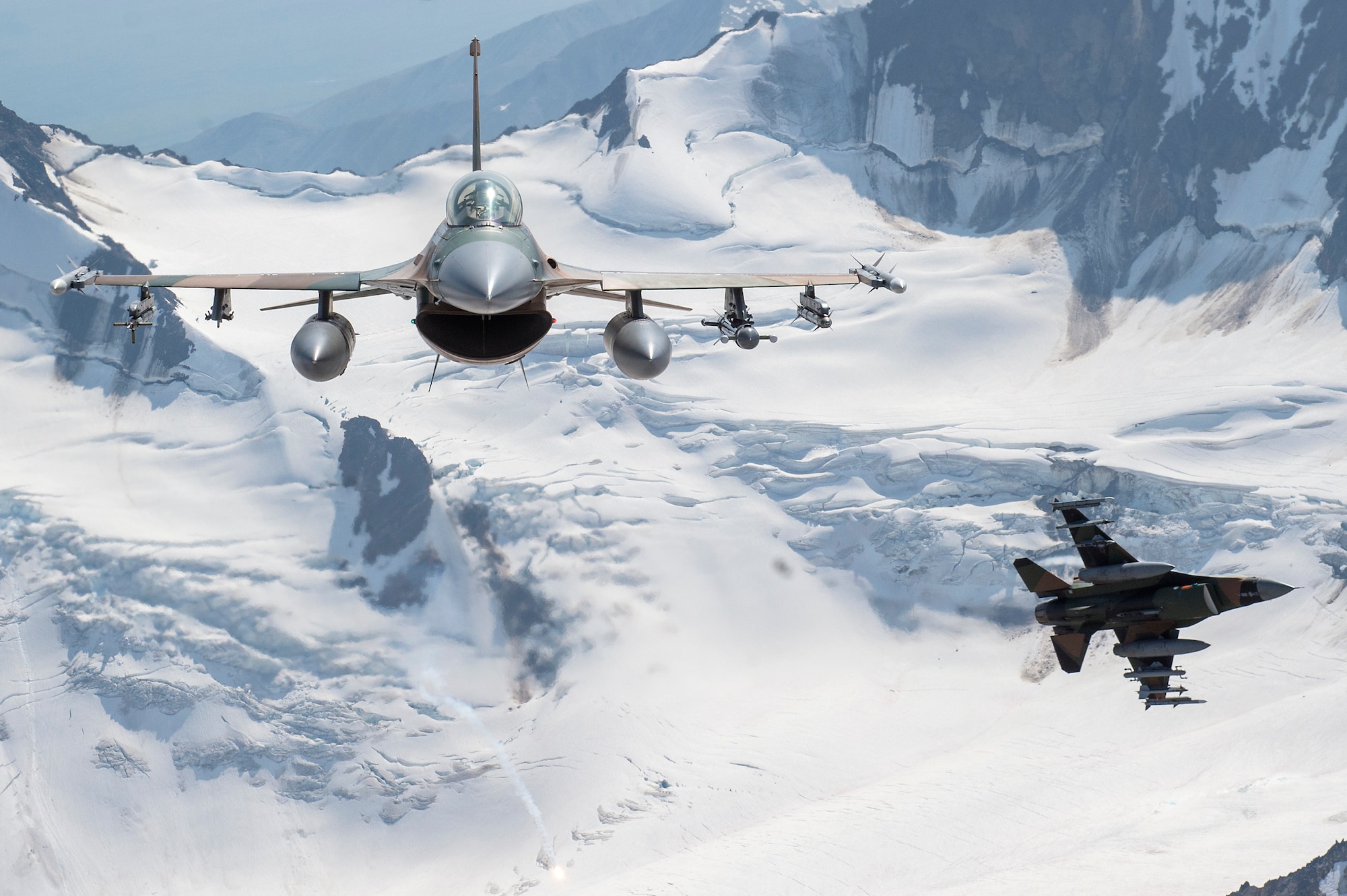 U.S. Air Force F-16 Fighting Falcons from Eielson Air Force Base, fly in formation over the Joint Pacific Alaska Range Complex, July 18, 2019.