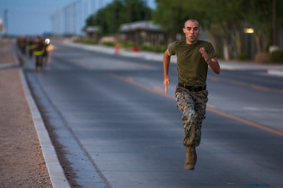 U.S. Marines assigned to Headquarters and Headquarters Squadron (H&HS) conduct H&HS's first Combat Fitness Test (CFT) of the year at Marine Corps Air Station Yuma, Ariz., July 17, 2019. A CFT is composed of an 880-yard sprint, lifting an ammunition can overhead repeatedly for two minutes, and performing a timed event, the maneuver-under-fire, in which Marines conduct combat-related tasks. (U.S. Marine Corps photo by Cpl. Sabrina Candiaflores)