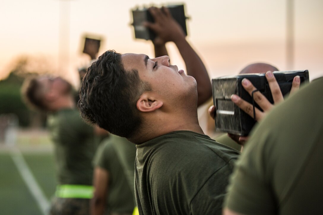 U.S. Marines assigned to Headquarters and Headquarters Squadron (H&HS) conduct H&HS's first Combat Fitness Test (CFT) of the year at Marine Corps Air Station Yuma, Ariz., July 17, 2019. A CFT is composed of an 880-yard sprint, lifting an ammunition can overhead repeatedly for two minutes, and performing a timed event, the maneuver-under-fire, in which Marines conduct combat-related tasks. (U.S. Marine Corps photo by Cpl. Sabrina Candiaflores)