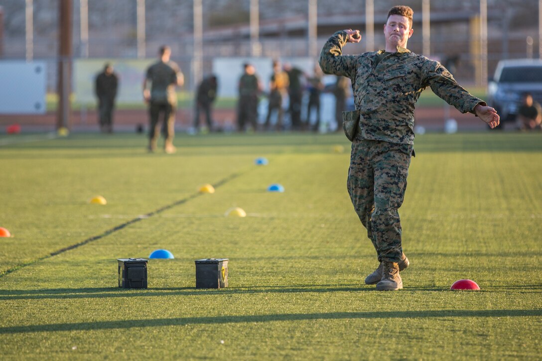 U.S. Marines assigned to Headquarters and Headquarters Squadron (H&HS) conduct H&HS's first Combat Fitness Test (CFT) of the year at Marine Corps Air Station Yuma, Ariz., July 17, 2019. A CFT is composed of an 880-yard sprint, lifting an ammunition can overhead repeatedly for two minutes, and performing a timed event, the maneuver-under-fire, in which Marines conduct combat-related tasks. (U.S. Marine Corps photo by Cpl. Sabrina Candiaflores)