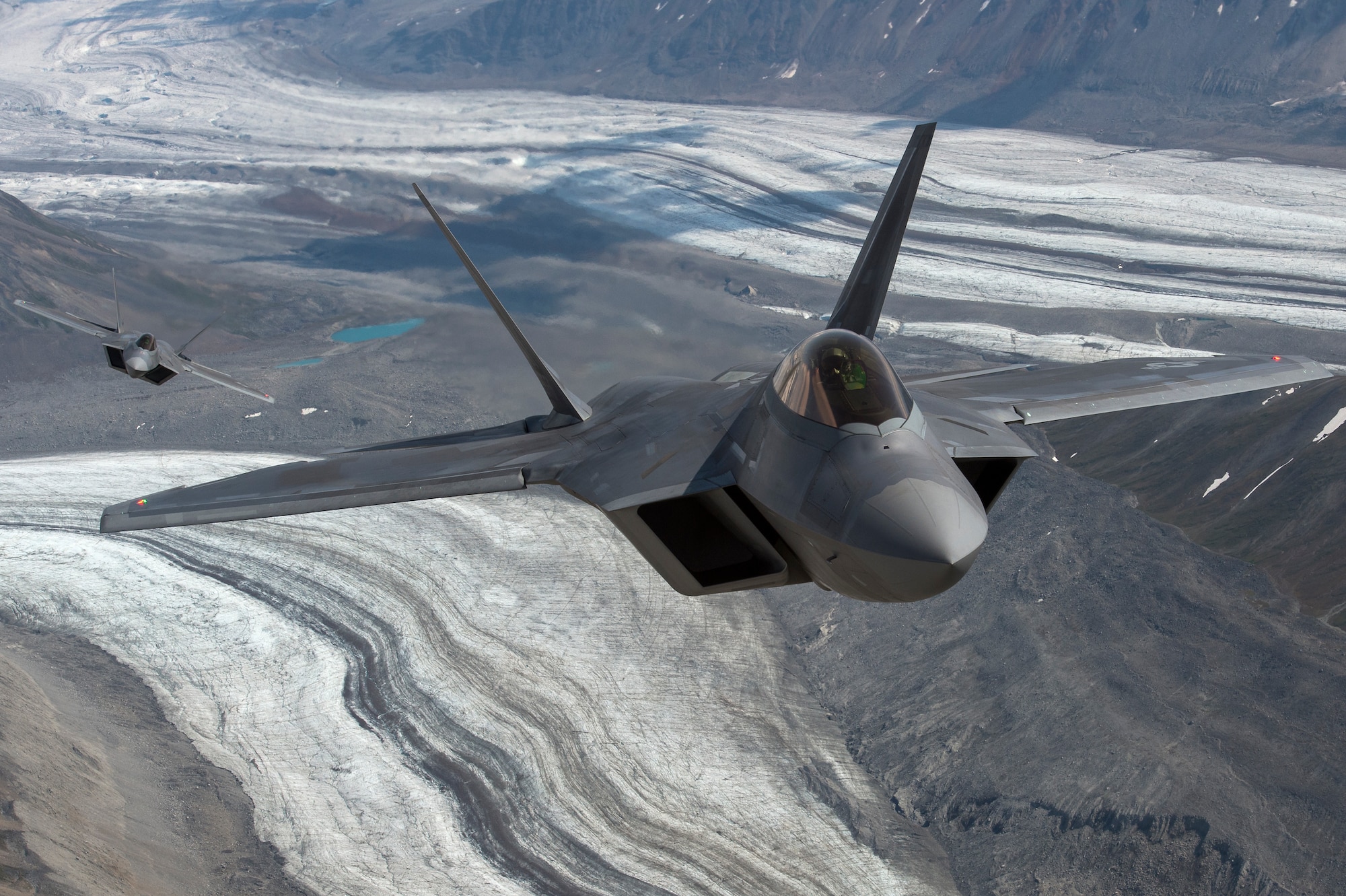 U.S. Air Force F-22 Raptors from Joint Base Elmendorf-Richardson, fly in formation over the Joint Pacific Alaska Range Complex, July 18, 2019.