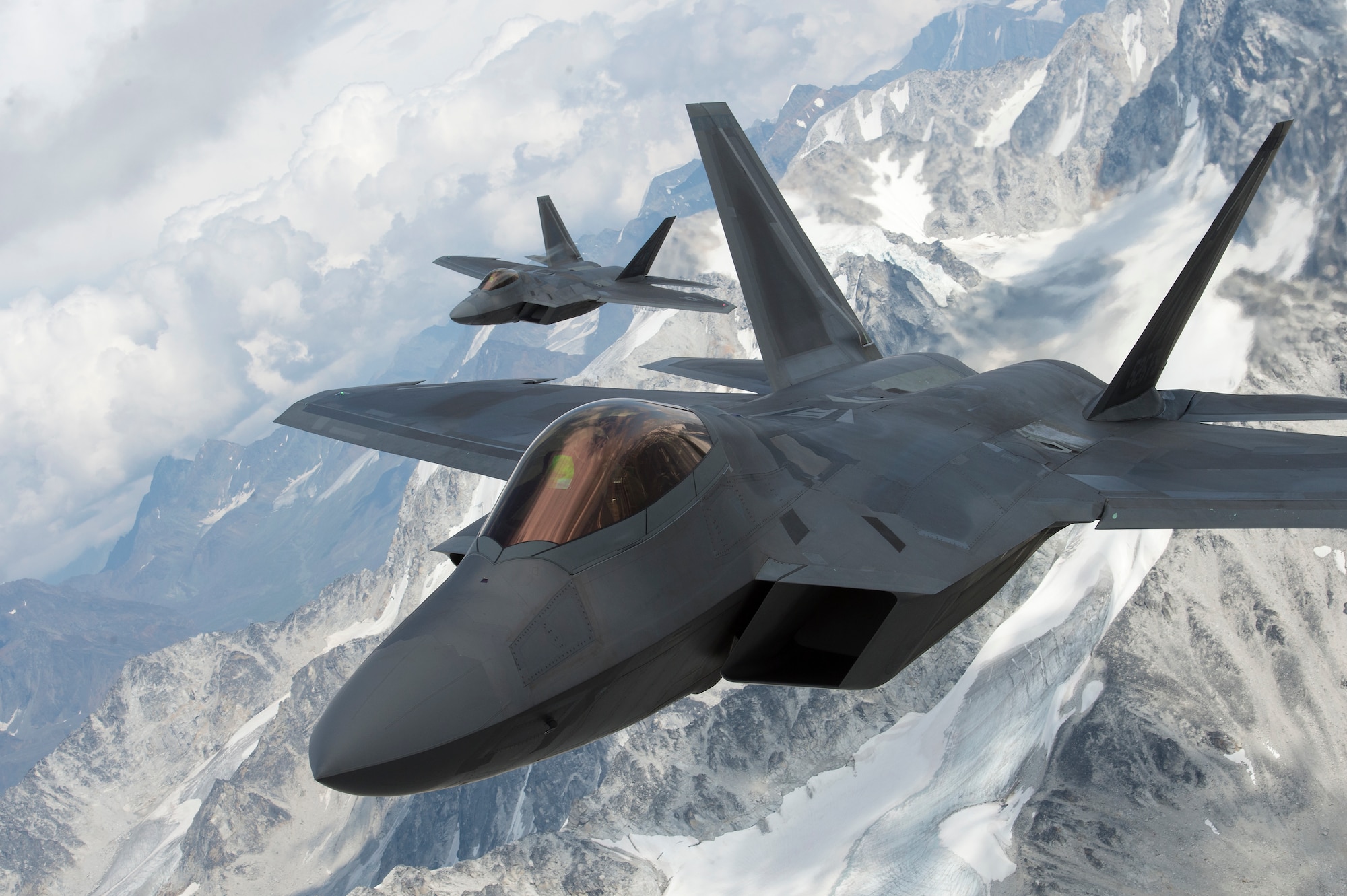 U.S. Air Force F-22 Raptors from Joint Base Elmendorf-Richardson, fly in formation over the Joint Pacific Alaska Range Complex, July 18, 2019.