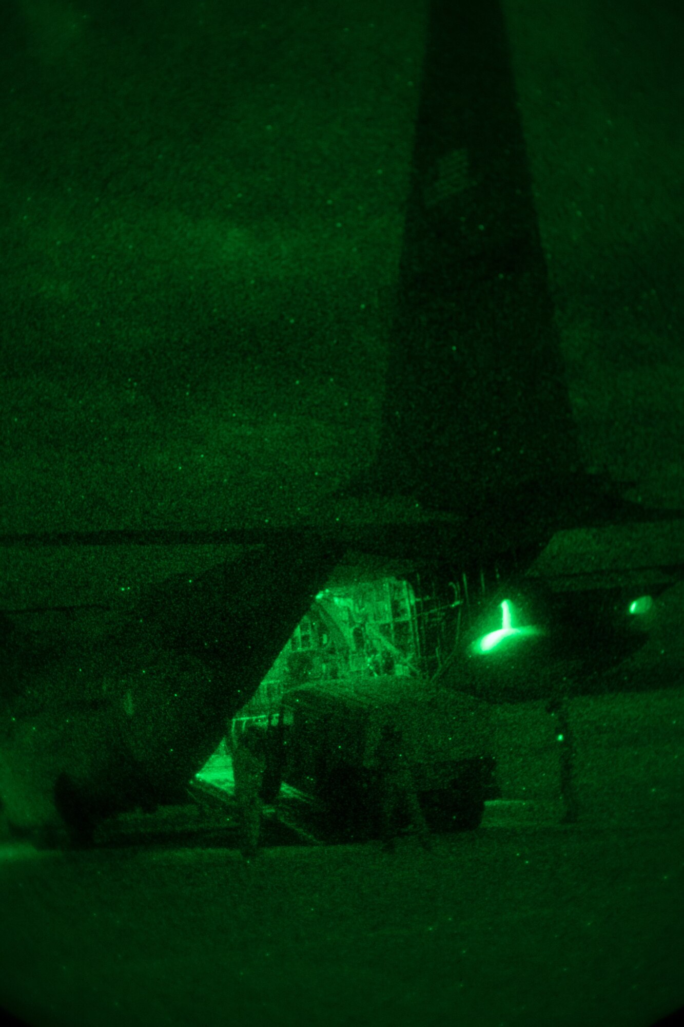 Airmen unload a vehicle from a C-130.