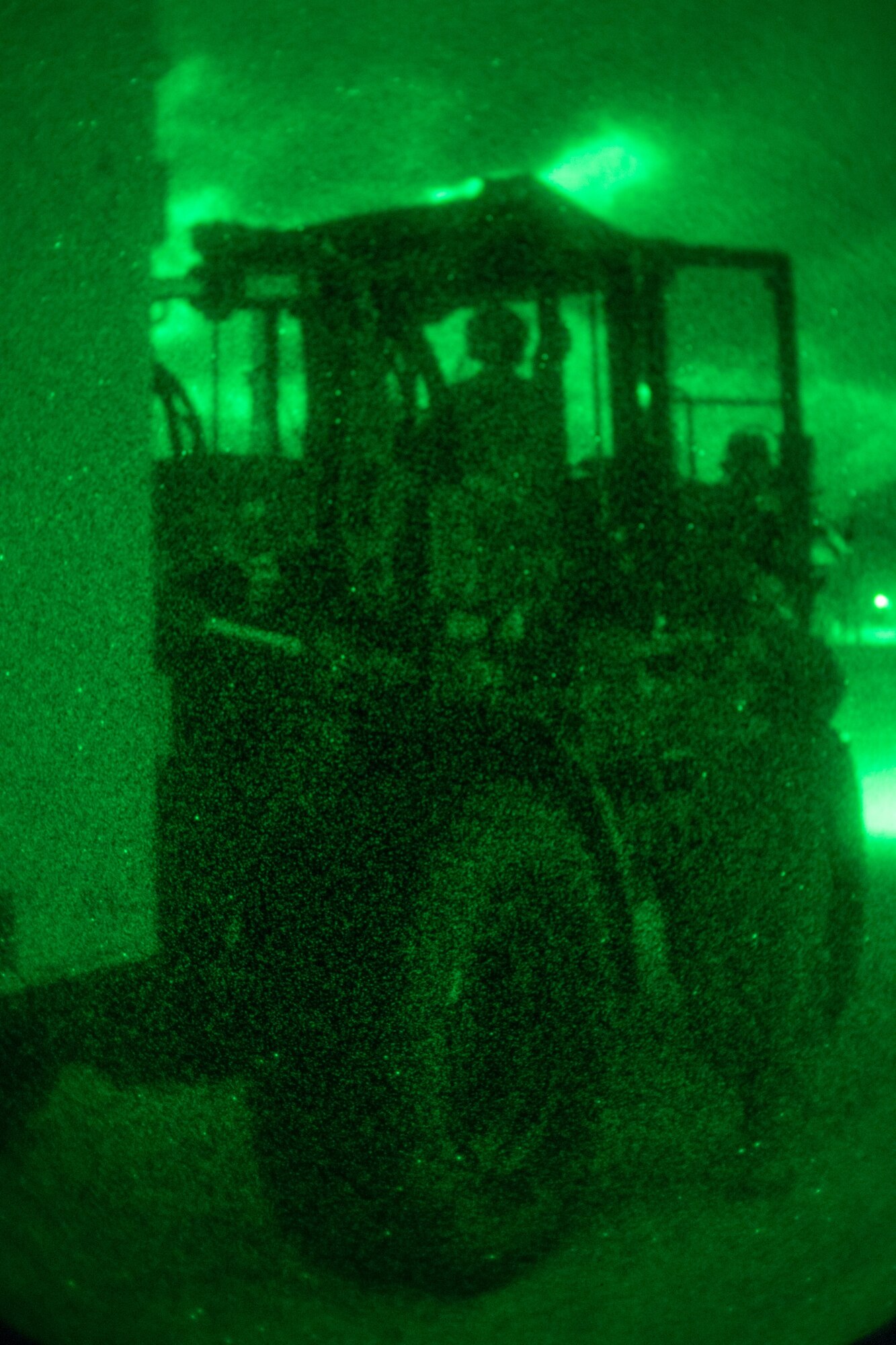 An Airman uses a fork lift to load cargo to a C-130.