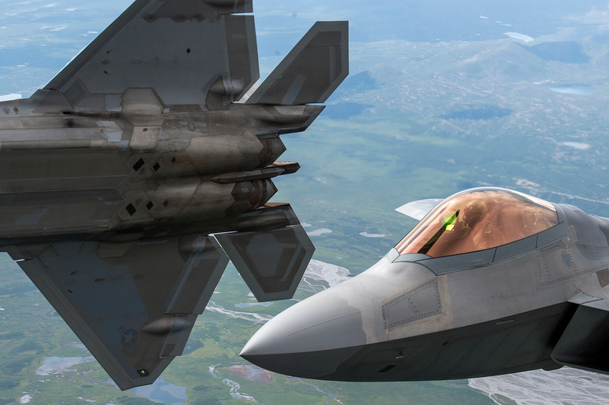 U.S. Air Force F-22 Raptors from Joint Base Elmendorf-Richardson, fly in formation over the Joint Pacific Alaska Range Complex, July 18, 2019.