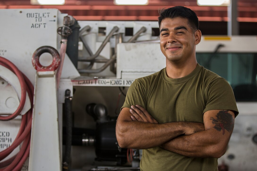 U.S. Marine Corps Lance Cpl. Alejandro Saavedra, a support equipment electrician assigned to Marine Aviation Logistics Squadron (MALS) 13, installs a fuel tank on a demineralization cart at Marine Corps Air Station (MCAS) Yuma, Ariz., July 17, 2019. (U.S. Marine Corps photo by Cpl. Sabrina Candiaflores)