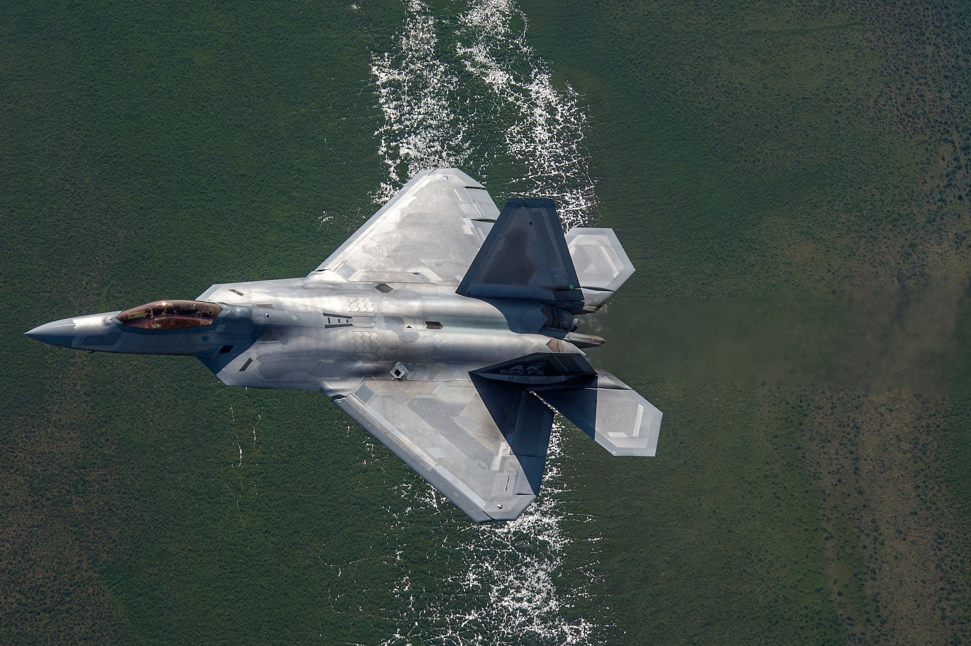 A U.S. Air Force F-22 Raptor from Joint Base Elmendorf-Richardson, flies in formation over the Joint Pacific Alaska Range Complex, July 18, 2019.