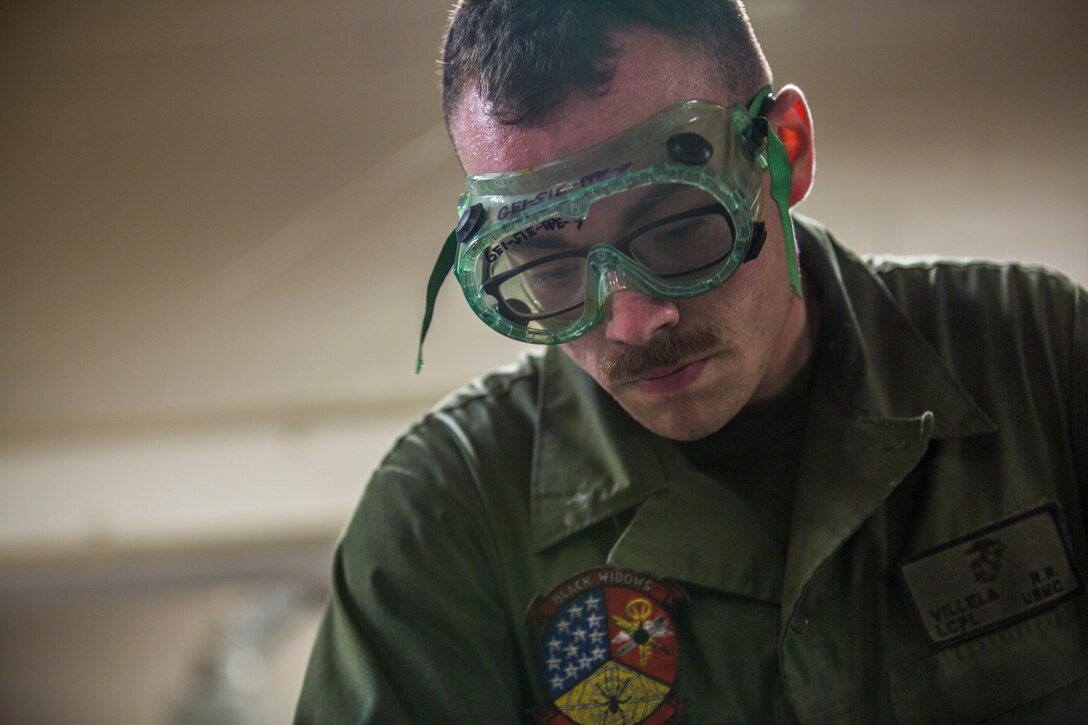 U.S. Marine Corps Lance Cpl. Billie Scott and Lance Cpl. Justin Stargell, aircraft maintenance specialists assigned to Marine Aviation Squadron (MALS) 13, break down multiple F-35B Lightning ll tires to be cleaned for their tire inspection at Marine Corps Air Station (MCAS) Yuma, Ariz., July 17, 2019. The MALS-13 Tire Shop inspects every tire they receive to ensure they are still good to use. (U.S. Marine Corps photo by Cpl. Sabrina Candiaflores)