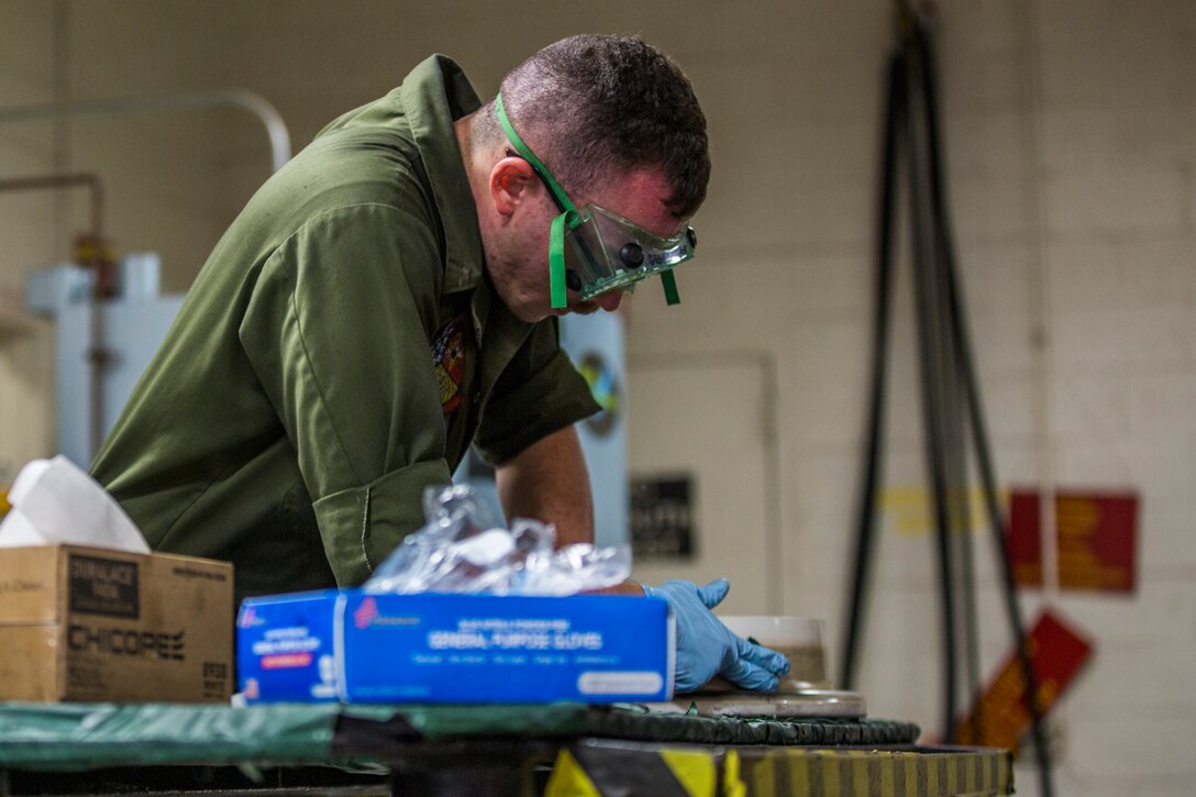 U.S. Marine Corps Lance Cpl. Billie Scott and Lance Cpl. Justin Stargell, aircraft maintenance specialists assigned to Marine Aviation Squadron (MALS) 13, break down multiple F-35B Lightning ll tires to be cleaned for their tire inspection at Marine Corps Air Station (MCAS) Yuma, Ariz., July 17, 2019. The MALS-13 Tire Shop inspects every tire they receive to ensure they are still good to use. (U.S. Marine Corps photo by Cpl. Sabrina Candiaflores)