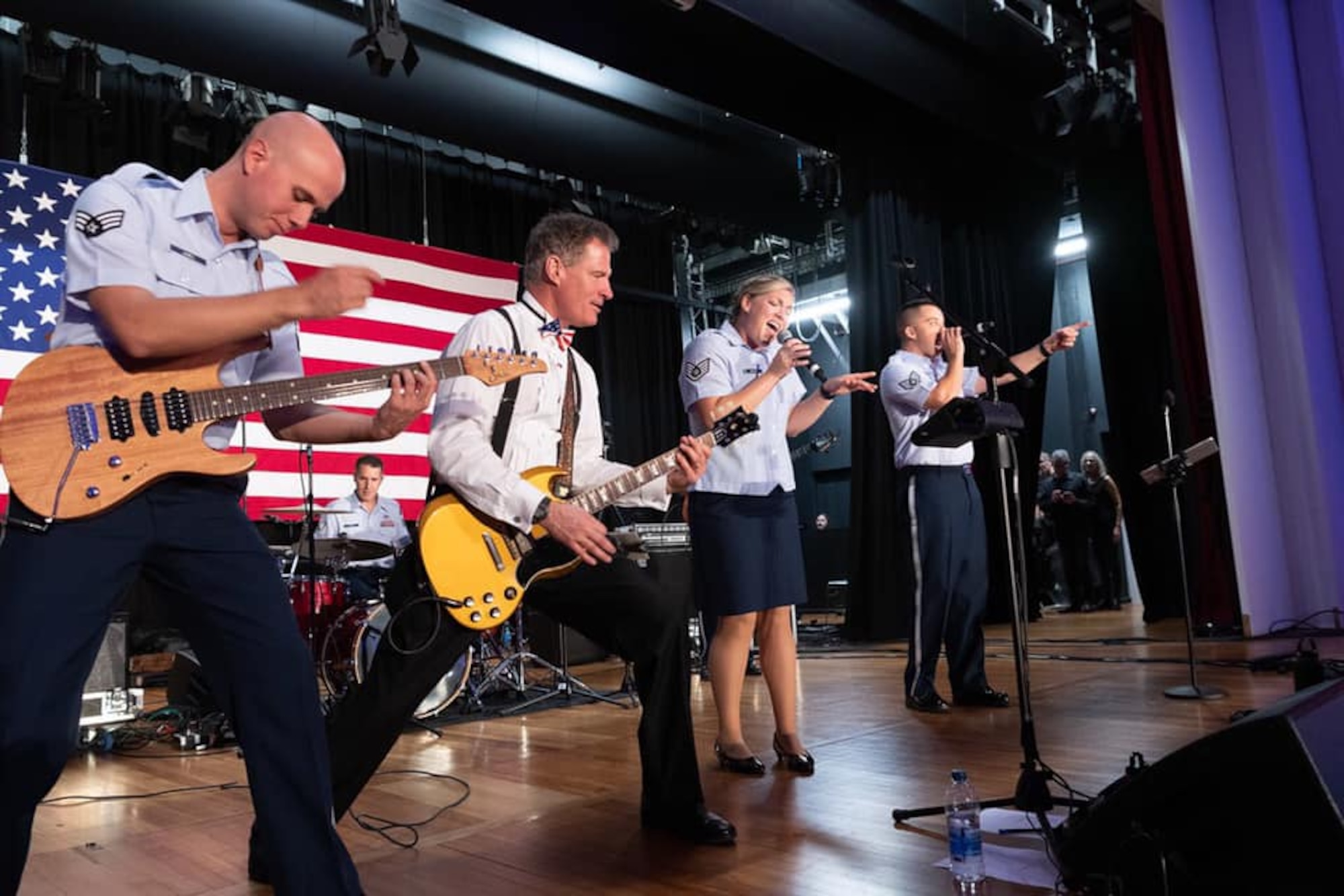 The US Ambassador to New Zealand, The Honorable Scott Philip Brown, joins Small Kine on stage for an electric performance during the US Embassys Independence day Celebrations.