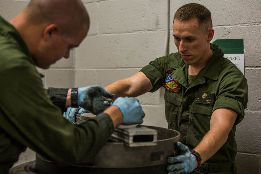 U.S. Marine Corps Lance Cpl. Billie Scott and Lance Cpl. Justin Stargell, aircraft maintenance specialists assigned to Marine Aviation Squadron (MALS) 13, break down multiple F-35B Lightning ll tires to be cleaned for their tire inspection at Marine Corps Air Station (MCAS) Yuma, Ariz., July 17, 2019. The MALS-13 Tire Shop inspects every tire they receive to ensure they are still good to use. (U.S. Marine Corps photo by Cpl. Sabrina Candiaflores)