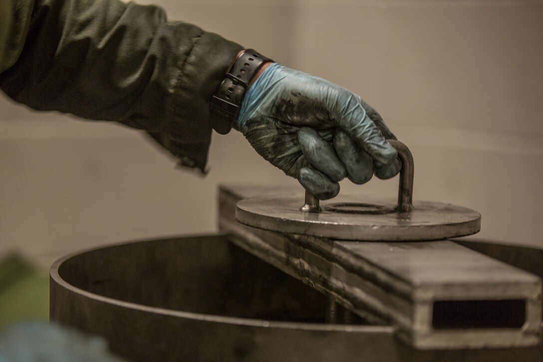 U.S. Marine Corps Lance Cpl. Billie Scott and Lance Cpl. Justin Stargell, aircraft maintenance specialists assigned to Marine Aviation Squadron (MALS) 13, break down multiple F-35B Lightning ll tires to be cleaned for their tire inspection at Marine Corps Air Station (MCAS) Yuma, Ariz., July 17, 2019. The MALS-13 Tire Shop inspects every tire they receive to ensure they are still good to use. (U.S. Marine Corps photo by Cpl. Sabrina Candiaflores)