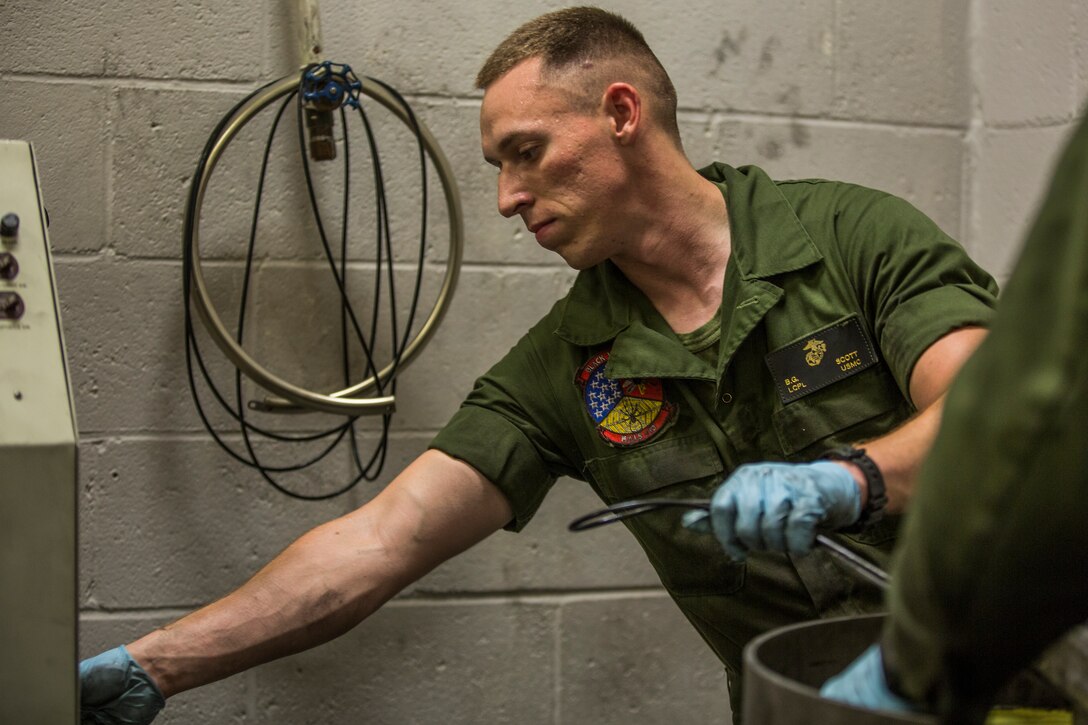 U.S. Marine Corps Lance Cpl. Billie Scott and Lance Cpl. Justin Stargell, aircraft maintenance specialists assigned to Marine Aviation Squadron (MALS) 13, break down multiple F-35B Lightning ll tires to be cleaned for their tire inspection at Marine Corps Air Station (MCAS) Yuma, Ariz., July 17, 2019. The MALS-13 Tire Shop inspects every tire they receive to ensure they are still good to use. (U.S. Marine Corps photo by Cpl. Sabrina Candiaflores)
