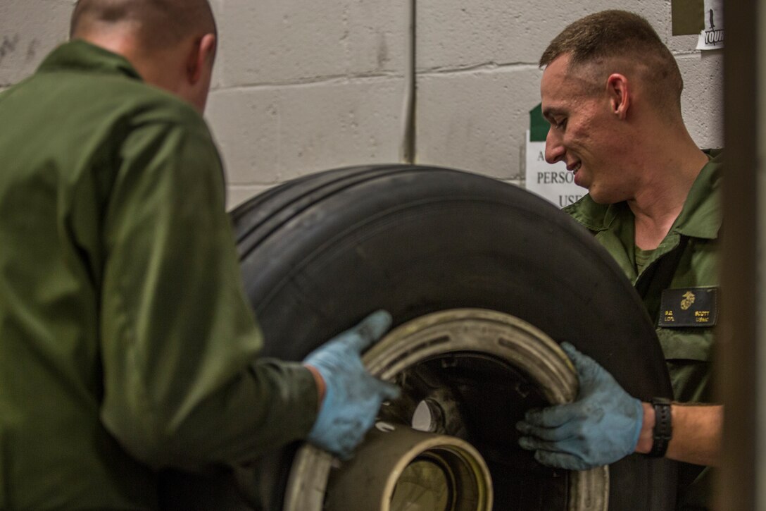 U.S. Marine Corps Lance Cpl. Billie Scott and Lance Cpl. Justin Stargell, aircraft maintenance specialists assigned to Marine Aviation Squadron (MALS) 13, break down multiple F-35B Lightning ll tires to be cleaned for their tire inspection at Marine Corps Air Station (MCAS) Yuma, Ariz., July 17, 2019. The MALS-13 Tire Shop inspects every tire they receive to ensure they are still good to use. (U.S. Marine Corps photo by Cpl. Sabrina Candiaflores)