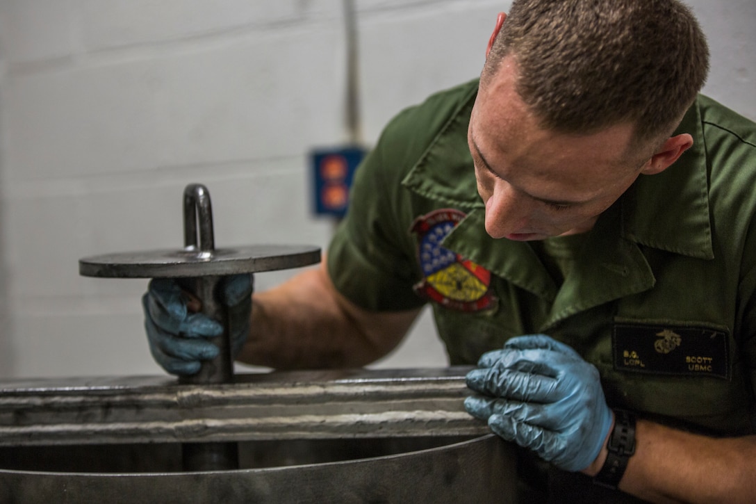 U.S. Marine Corps Lance Cpl. Billie Scott and Lance Cpl. Justin Stargell, aircraft maintenance specialists assigned to Marine Aviation Squadron (MALS) 13, break down multiple F-35B Lightning ll tires to be cleaned for their tire inspection at Marine Corps Air Station (MCAS) Yuma, Ariz., July 17, 2019. The MALS-13 Tire Shop inspects every tire they receive to ensure they are still good to use. (U.S. Marine Corps photo by Cpl. Sabrina Candiaflores)