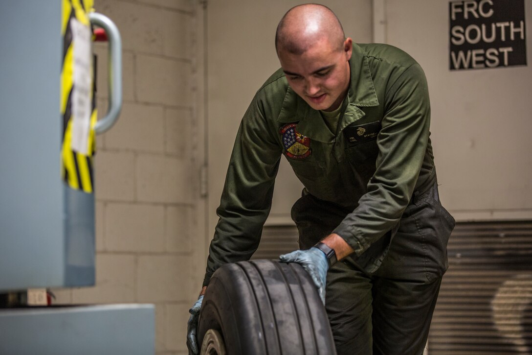 U.S. Marine Corps Lance Cpl. Billie Scott and Lance Cpl. Justin Stargell, aircraft maintenance specialists assigned to Marine Aviation Squadron (MALS) 13, break down multiple F-35B Lightning ll tires to be cleaned for their tire inspection at Marine Corps Air Station (MCAS) Yuma, Ariz., July 17, 2019. The MALS-13 Tire Shop inspects every tire they receive to ensure they are still good to use. (U.S. Marine Corps photo by Cpl. Sabrina Candiaflores)