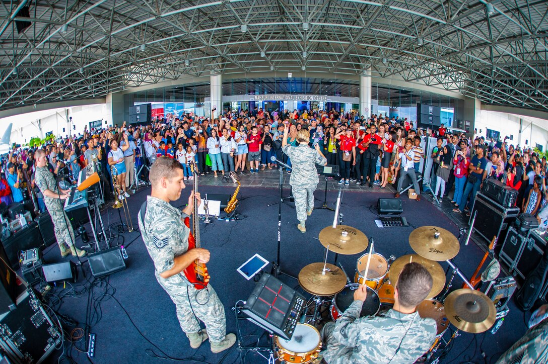 Hana Hou performs for visitors at the Langkawi Interntaional Maritime & Aerospace Exhibition in Malaysia.