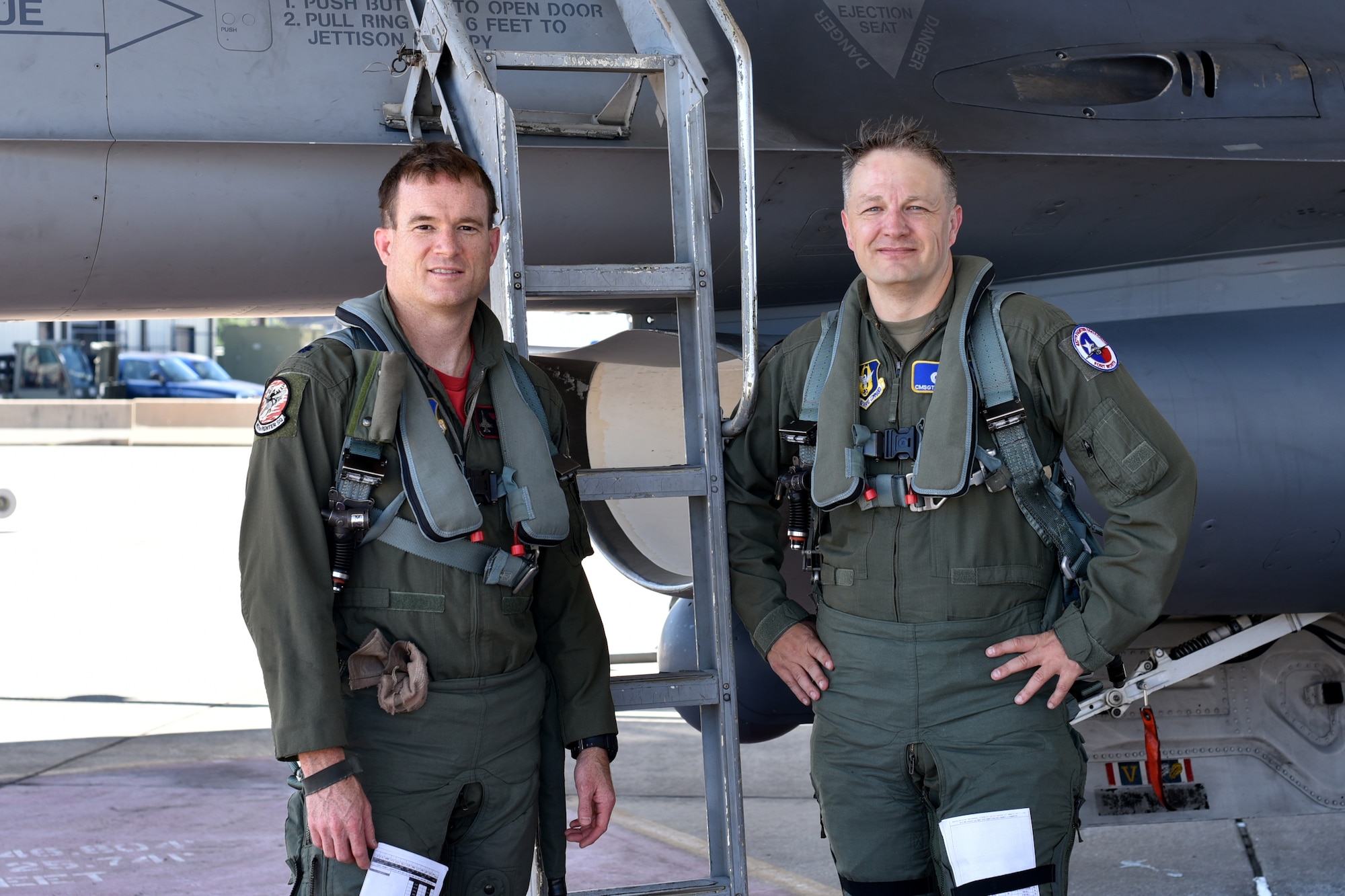 Lt. Col. Kenneth Seiver, a 457th Fighter Squadron F-16 pilot and Chief Master Sgt. James Loper, 10th Air Force command chief, take a moment after a familiarization flight at Naval Air Station Fort Worth Joint Reserve Base, Texas on July 12, 2019. The flight gave Loper a hands-on understanding of the jet's capabilities and the squadron’s mission. (U.S. Air Force photo by Senior Airman Randall Moose)