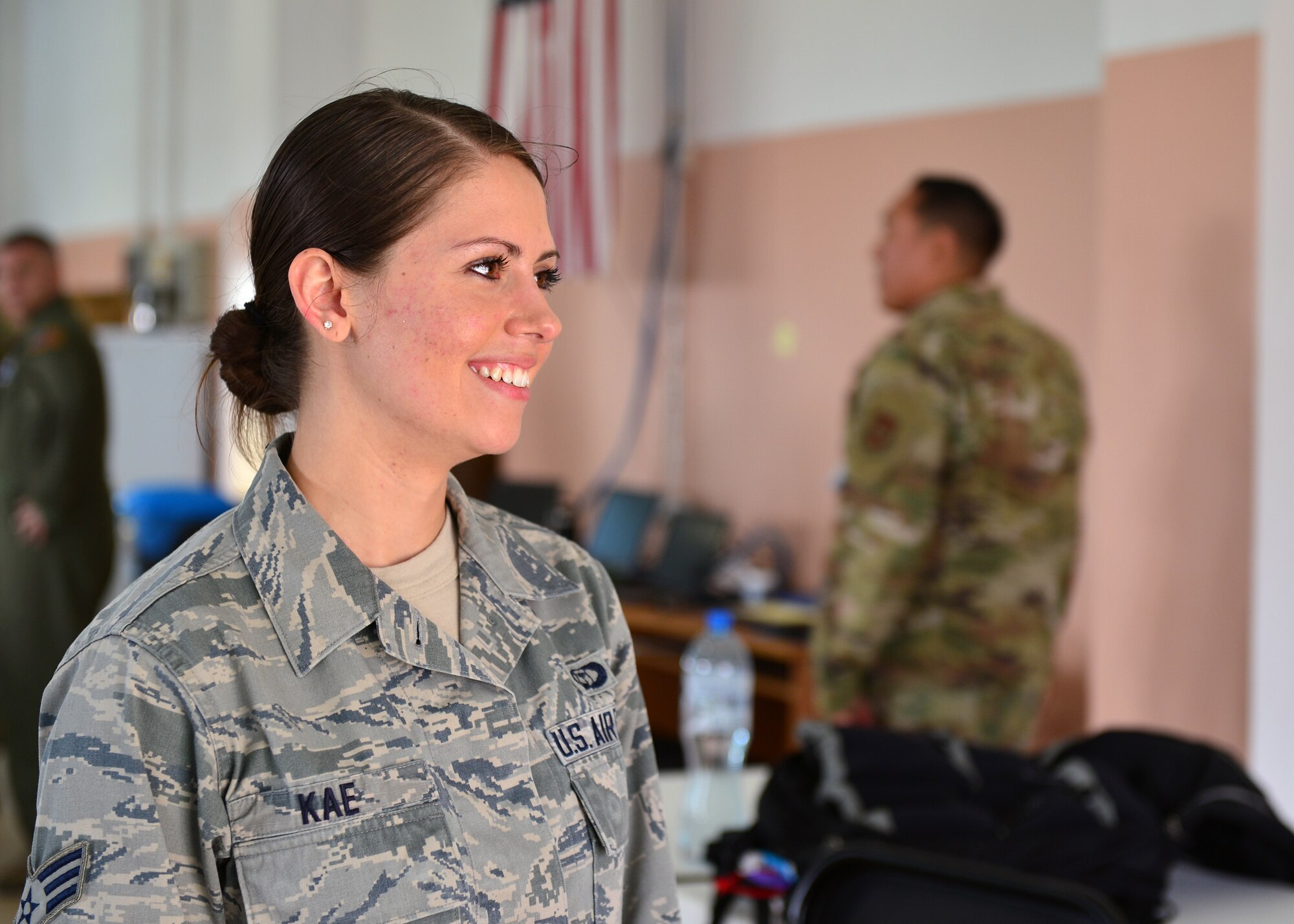 U.S. Air Force Senior Airman Julie Kae, 86th Operations Support Squadron weather forecaster, participates in an interview at Powidz Air Base, Poland, July 10, 2019. Kae was the sole forecaster deployed with the 37th Airlift Squadron in support of Aviation Rotation 19-3 and was responsible for conducting research, consolidating weather information, and briefing aircrew members before flights. (U.S. Air Force photo by Staff Sgt. Jimmie D. Pike)