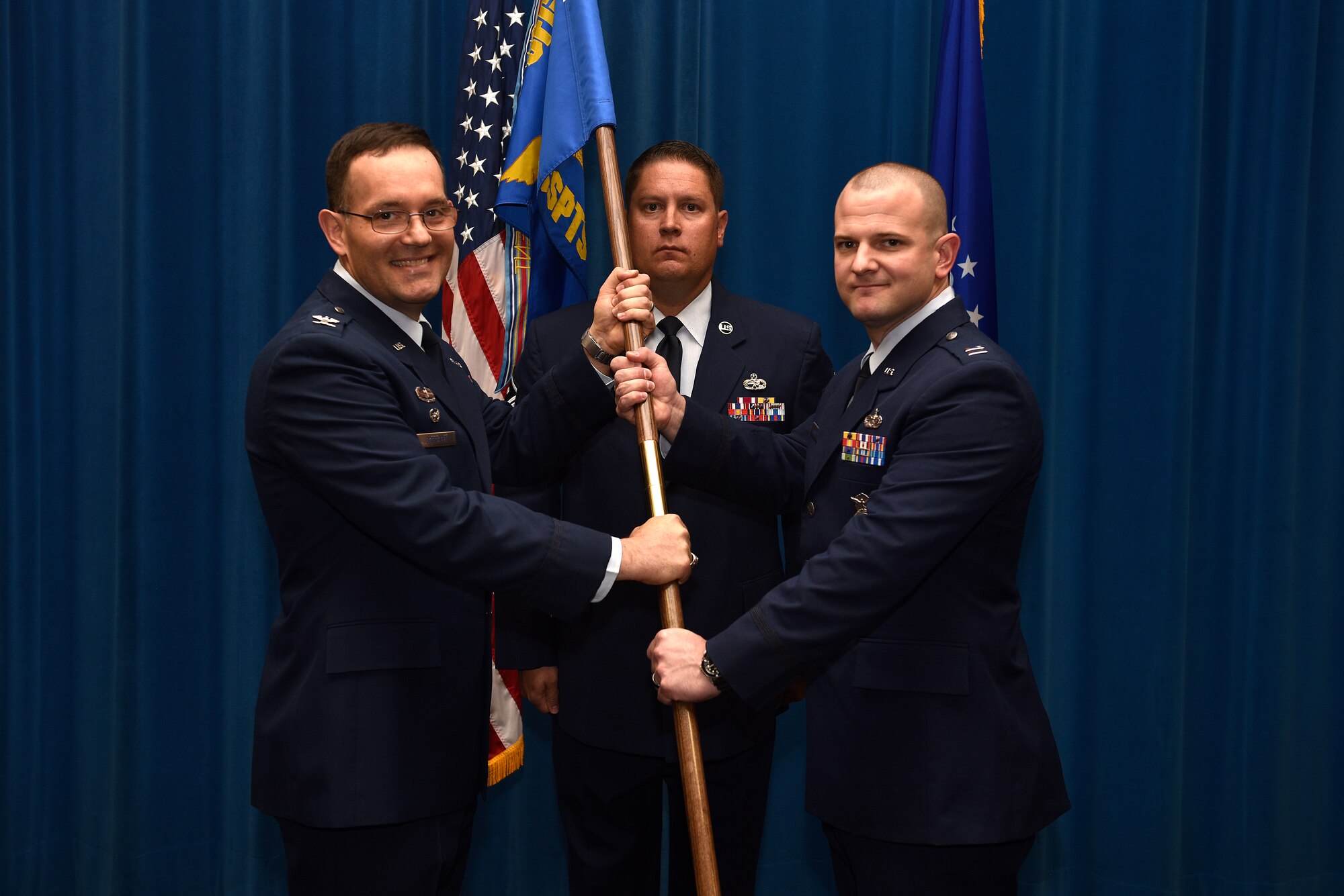U.S. Air Force Capt. Rudolph McIntyre IV accepts the guidon and command of the 377th Security Support Squadron from Col. Theodore Breuker, 377th Security Forces Group commander, in an assumption of command ceremony at Kirtland Air Force Base, N.M., July 23, 2019. McIntyre comes from Spangdahlem Air Base, Germany, where he was the anti-terrorism officer for the 52nd Fighter Wing. (U.S. Air Force photo by Airman 1st Class Austin J. Prisbrey)