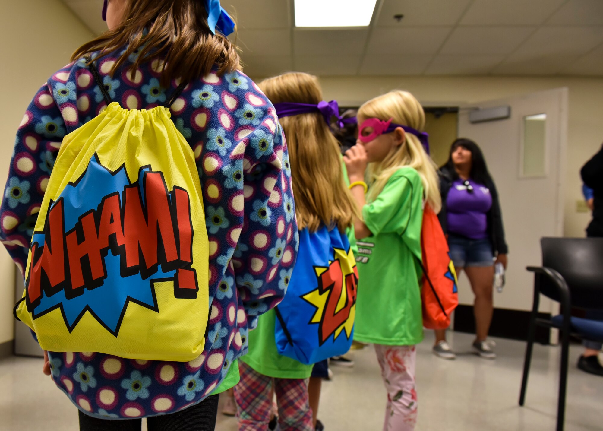 Children wait in line to participate in Operation Kids Understanding Deployment Operations