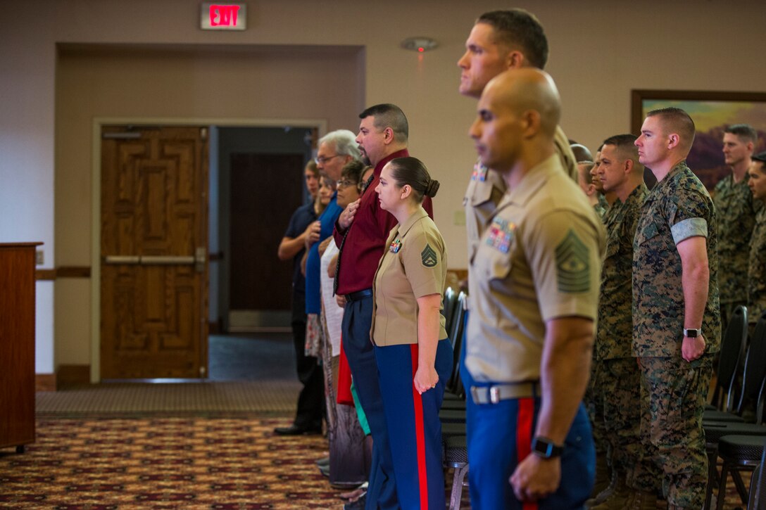 U.S. Marine Corps Staff Sgt. Nicole Showman retires after 20 years of service at the Sonoran Pueblo on Marine Corps Air Station Yuma, Ariz., July 12, 2019. Showman also received a Navy-Marine Corps Achievment Medal for her superior performance as the Headquarters and Headquarters Squadron Career Planner from June 2018 to July 2019. (U.S. Marine Corps photo by Cpl. Sabrina Candiaflores)