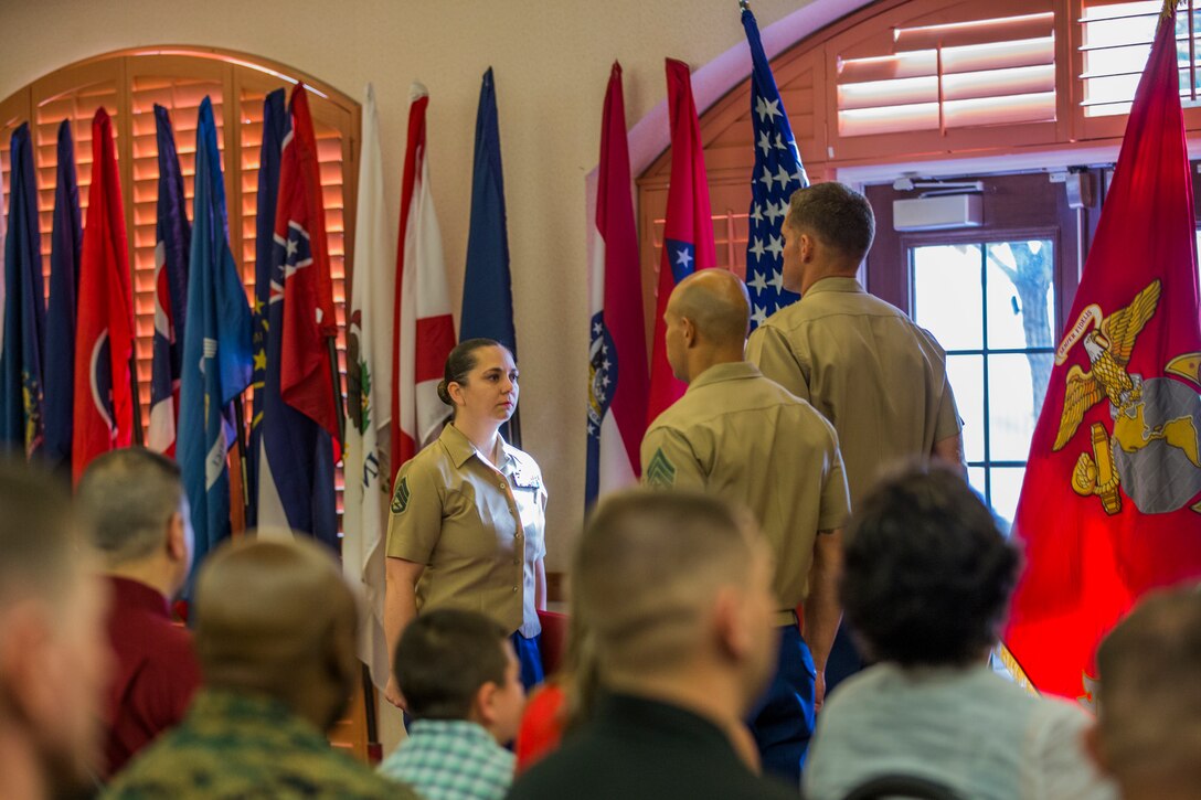 U.S. Marine Corps Staff Sgt. Nicole Showman retires after 20 years of service at the Sonoran Pueblo on Marine Corps Air Station Yuma, Ariz., July 12, 2019. Showman also received a Navy-Marine Corps Achievment Medal for her superior performance as the Headquarters and Headquarters Squadron Career Planner from June 2018 to July 2019. (U.S. Marine Corps photo by Cpl. Sabrina Candiaflores)