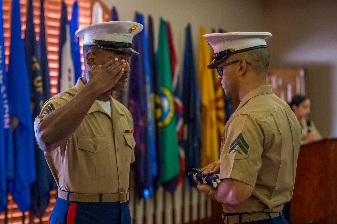 U.S. Marine Corps Staff Sgt. Nicole Showman retires after 20 years of service at the Sonoran Pueblo on Marine Corps Air Station Yuma, Ariz., July 12, 2019. Showman also received a Navy-Marine Corps Achievment Medal for her superior performance as the Headquarters and Headquarters Squadron Career Planner from June 2018 to July 2019. (U.S. Marine Corps photo by Cpl. Sabrina Candiaflores)