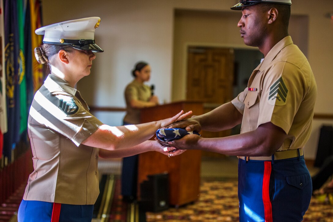 U.S. Marine Corps Staff Sgt. Nicole Showman retires after 20 years of service at the Sonoran Pueblo on Marine Corps Air Station Yuma, Ariz., July 12, 2019. Showman also received a Navy-Marine Corps Achievment Medal for her superior performance as the Headquarters and Headquarters Squadron Career Planner from June 2018 to July 2019. (U.S. Marine Corps photo by Cpl. Sabrina Candiaflores)