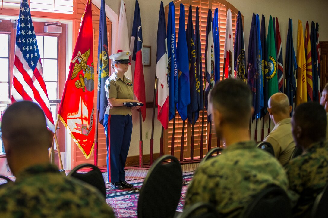 U.S. Marine Corps Staff Sgt. Nicole Showman retires after 20 years of service at the Sonoran Pueblo on Marine Corps Air Station Yuma, Ariz., July 12, 2019. Showman also received a Navy-Marine Corps Achievment Medal for her superior performance as the Headquarters and Headquarters Squadron Career Planner from June 2018 to July 2019. (U.S. Marine Corps photo by Cpl. Sabrina Candiaflores)